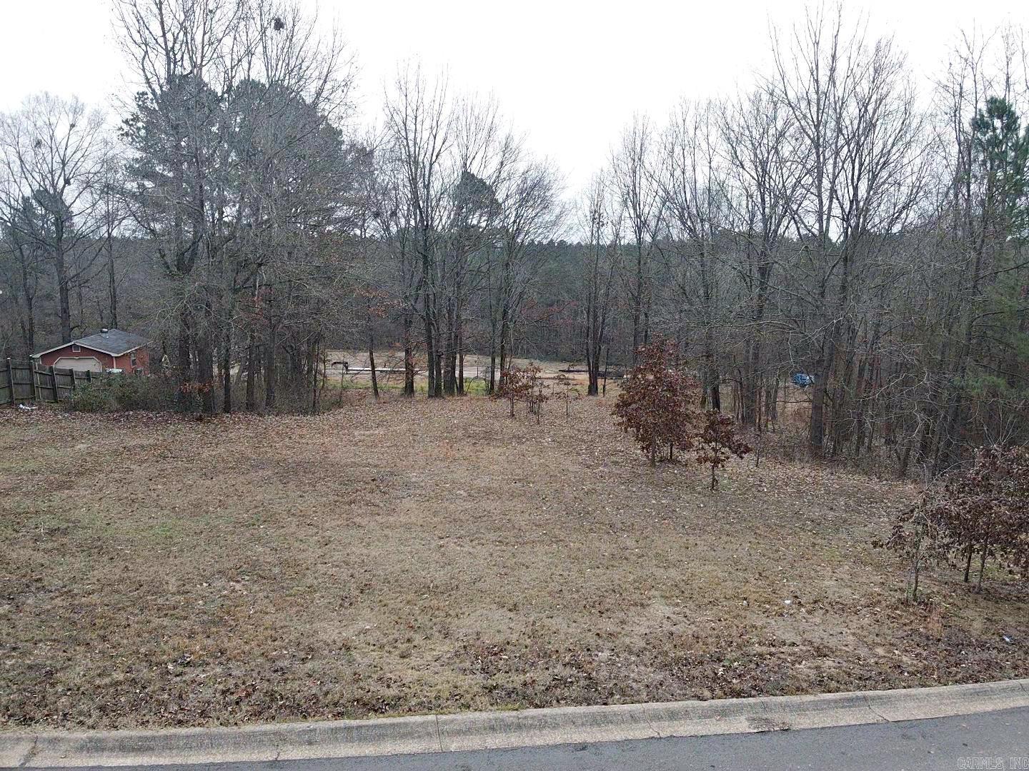 Beautiful residential lot located within the city limits in a highly desirable subdivision. The front portion of the lot is level, making it ideal for building, while the backside gently slopes downward-- perfect for a walk-out basement or enhanced backyard privacy. The property is subject to established covenants and restrictions, helping the quality and long-term value of the neighborhood. Enjoy city conveniences alongside the appeal of a well-planned, attractive subdivision. A great opportunity to build your dream home in a sought after area. More Photos to Come.