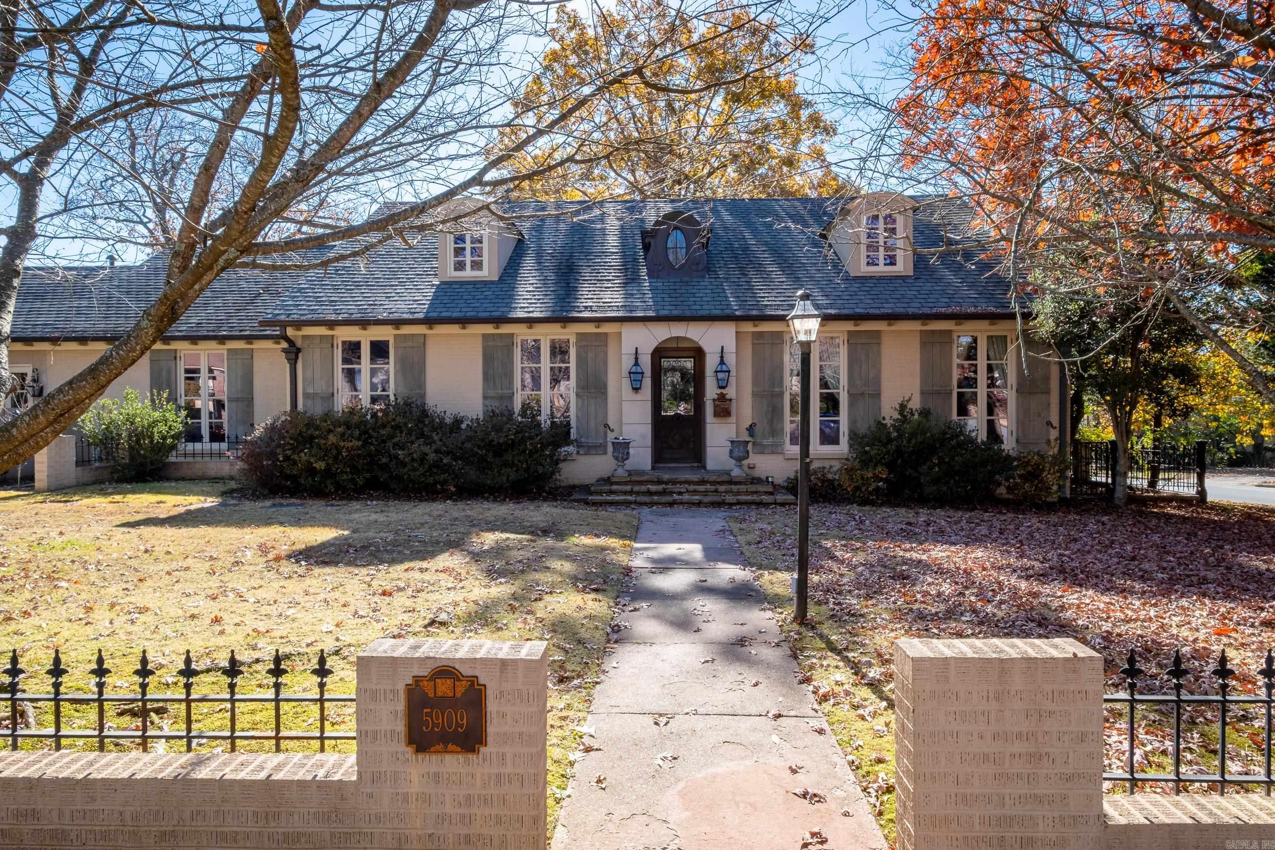 Stunning home in The Heights on 2 Lots. This home has amazing attention to every detail. Master suite on the main level offers a Fireplace, sitting area, beautiful bath, and a dream closet. Chefs kitchen, two living areas, large dining room, breakfast sun room on main level. Upstairs in two bedrooms, bath, and sitting area. Additional bonus room or could be a bedroom or work room up upstairs on other side of home. Amazing detached studio in back has a ton of possibilities. Being Sold "AS-IS".  SEE REMARKS