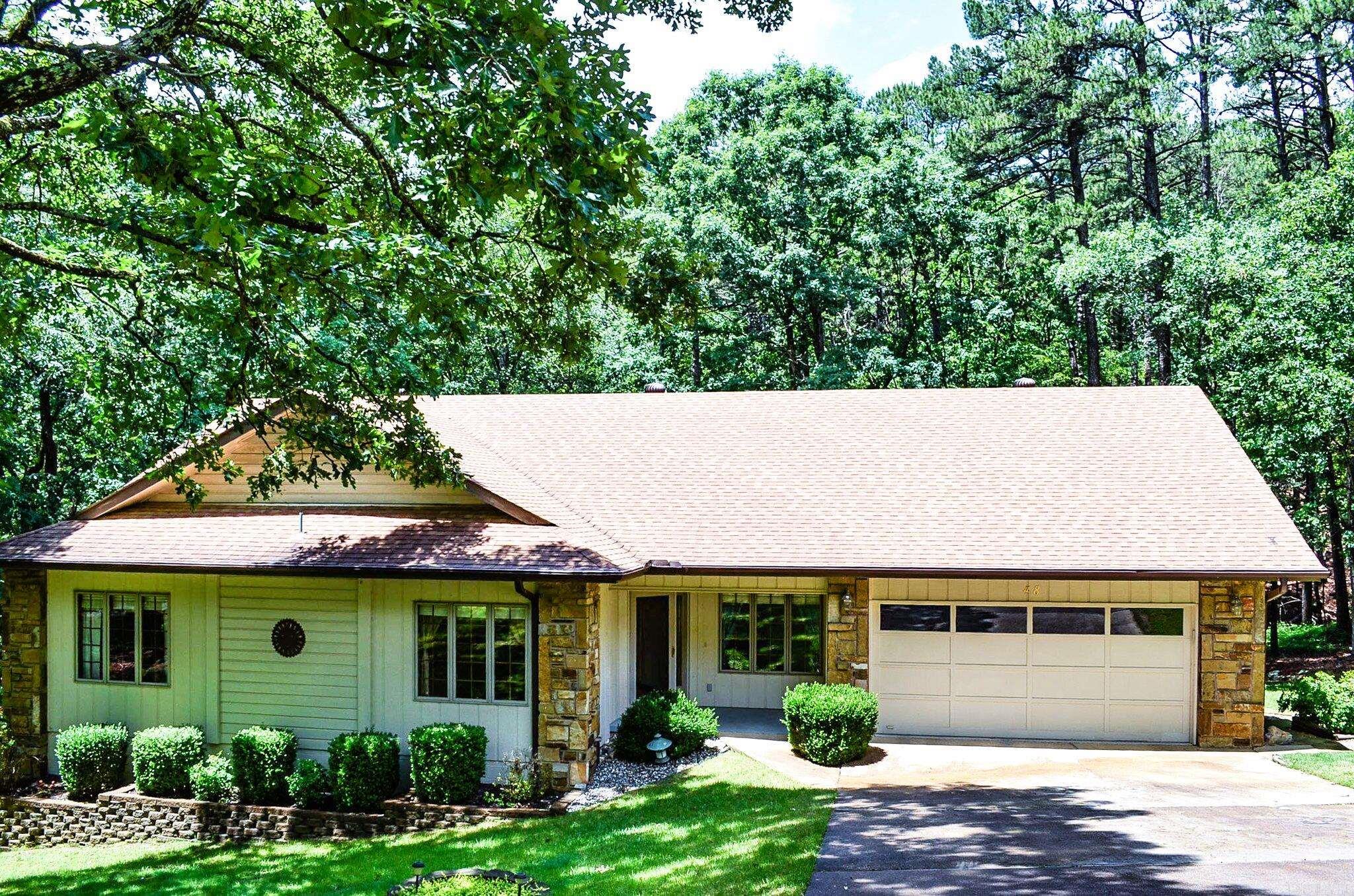 Nestled on a beautiful private wooded lot, this spacious 2,189 square foot home offers comfortable one-level living with thoughtful updates.  Built in 1986, the home features a desirable floor plan with generous living spaces  and abundant light.  The updated kitchen is sure to impress with granite countertops, a newer stove and refrigerator and plenty of workspace for cooking and entertaining.  Recent interior paint (2023) provides a fresh, move-in-ready feel.  Enjoy the peaceful outdoor setting from the large deck, rebuilt in 2021, overlooking the natural beauty of the surrounding woods.  Major improvements include a roof replaced in 2015 and HVAC system updated in 2014, offering added peace of mind.  A standout feature is the enormous workshop located below the home-perfect for hobbies, woodworking, storage or creating the ultimate workspace.  If you are looking for privacy, convenience and valuable updates in a well-maintained  home, this property is a must see!