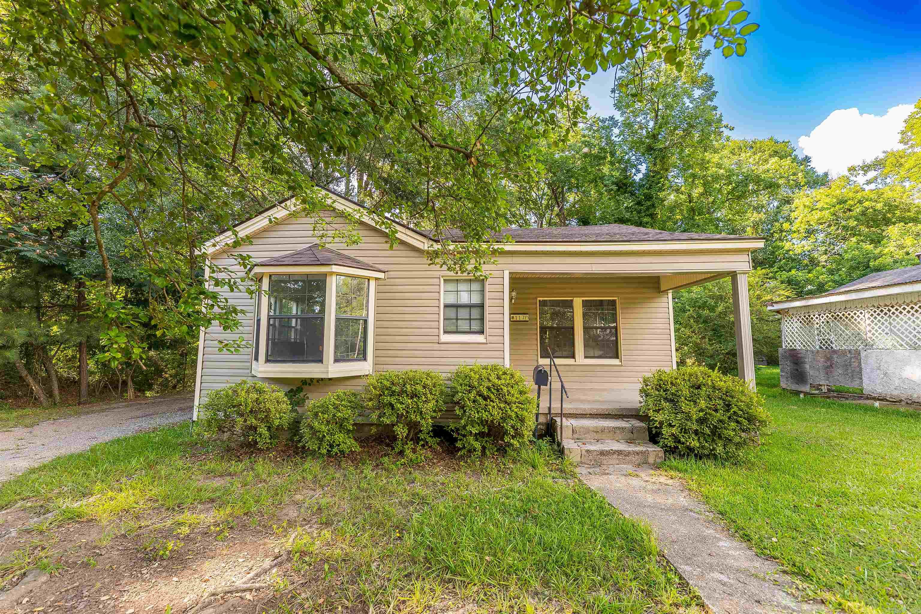 This inviting 2-bedroom, 1-bath home offers the perfect blend of comfort, character, and practicality. The spacious living room provides plenty of room to relax, gather with friends and family, or entertain guests. A beautiful bay window fills the home with natural light, creating a bright and welcoming atmosphere.  The kitchen is designed with convenience in mind, featuring smart built-in storage solutions that help maximize space and keep everything organized. Durable siding adds value and peace of mind, while the desirable corner lot offers extra outdoor space and attractive curb appeal.  Whether you're searching for your first home, looking to downsize, or seeking a great investment opportunity, this well-maintained property offers comfort, functionality, and charm in one appealing package.  Move-in ready and full of character, this corner-lot gem combines thoughtful features, spacious living areas, and lasting value—don't miss your opportunity to make it yours!