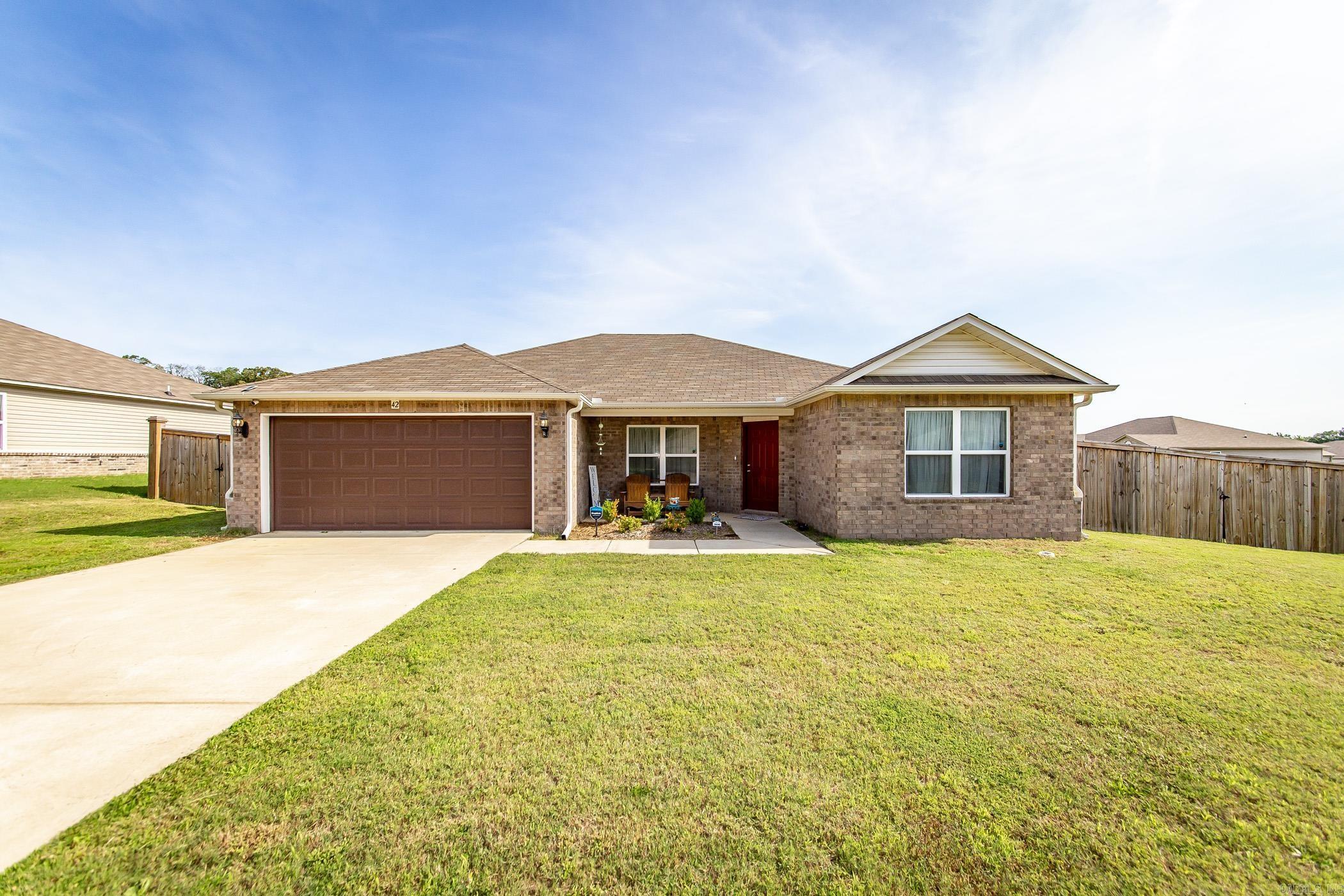 Welcome to your dream home! This immaculate 4-bedroom, 2-bathroom gem, built in 2022, is on a desirable corner lot, which offers extra space and curb appeal. Enjoy the seamless flow from the living room to the kitchen, perfect for entertaining and daily living. This property has a fully fenced yard ideal for children, pets, and outdoor activities. Situated in a friendly neighborhood, this home is close to schools, parks, shopping, and dining options. Easy access to major highways ensures a smooth commute to the city and surrounding areas. Don't miss the opportunity to make this stunning, move-in-ready house your forever home. Schedule a showing today and experience the perfect combination of style, comfort, and convenience!