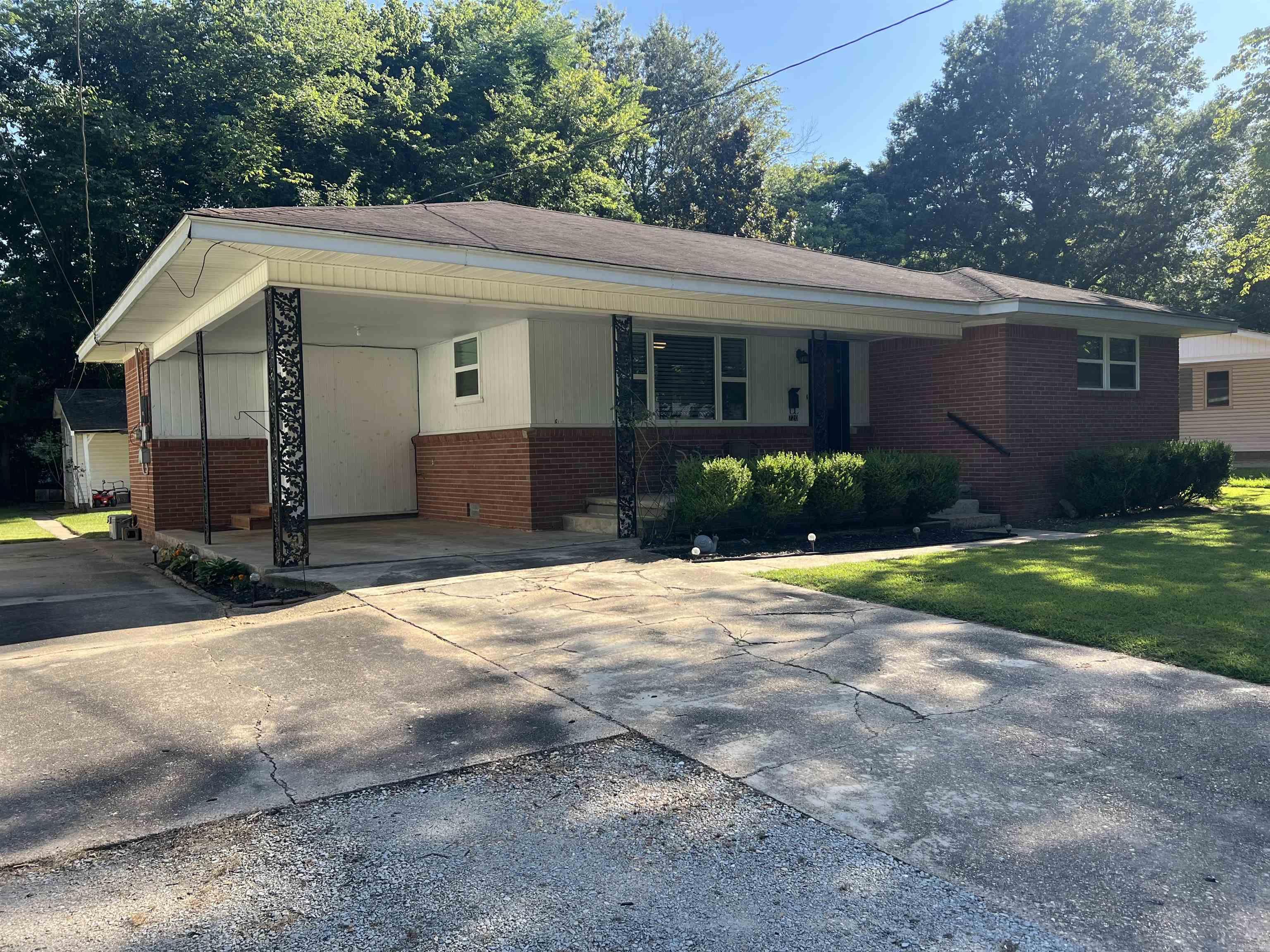 Welcome home to this charming and well-maintained 2-bedroom, 1-bath home offering 1,116 square feet of comfortable living space on a 0.19-acre lot. You'll love the character of the original hardwood floors paired with the convenience of a recently updated bathroom and all-new windows, providing improved energy efficiency and natural light throughout.  The kitchen comes fully equipped with all appliances, including the washer and dryer, making this home truly move-in ready. Outside, you'll find a single-car carport with additional parking, plus a workshop/storage shed in the backyard that's perfect for hobbies, tools, or extra storage.  Whether you're a first-time homebuyer, looking to downsize, or searching for a great investment property, this home offers comfort, convenience, and value in a quiet neighborhood.