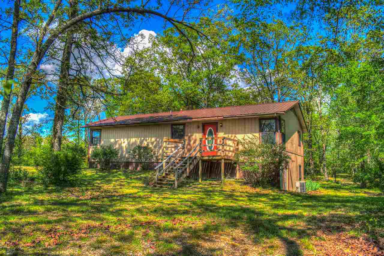 Country home on 10.13 Acres with basement. This house has definitely got more than meets the eye. 676 sq. foot partially finished basement below a 1248 sq. foot home definitely gives you room to grow. Barn, stock pond, fenced.