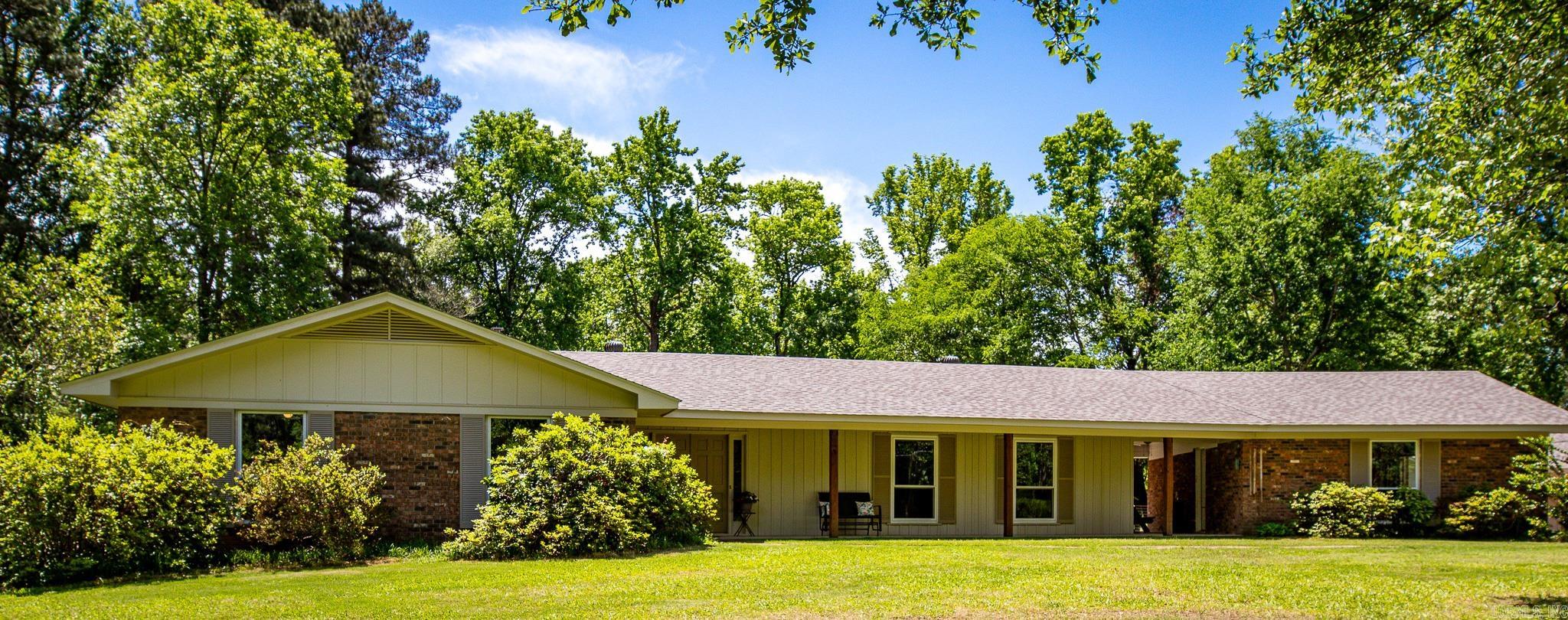 Beautifully renovated and move-in ready, this 3-bedroom, 3-bath home offers 2,198 square feet of updated living space on 4.62 partially cleared and fenced acres, perfect for a mini homestead, hobby farm, or simply enjoying extra room to spread out. Conveniently located just minutes from retail, grocery stores, and local public schools, this property offers the best of both worlds: peaceful country living outside city limits while still being connected to city water.  Inside, you’ll find thoughtful updates throughout, including a recently remodeled kitchen featuring gorgeous cabinetry, quartz countertops, and new appliances. Major upgrades provide peace of mind with a new roof and HVAC system installed in 2025.  Outside, the 36x24 shop with electricity offers endless possibilities for storage, projects, equipment, or workspace needs. On the backside of the property, you'll find a creek. Whether you’re looking for space to garden, raise animals, entertain, or simply enjoy a little privacy, this property checks all the boxes.