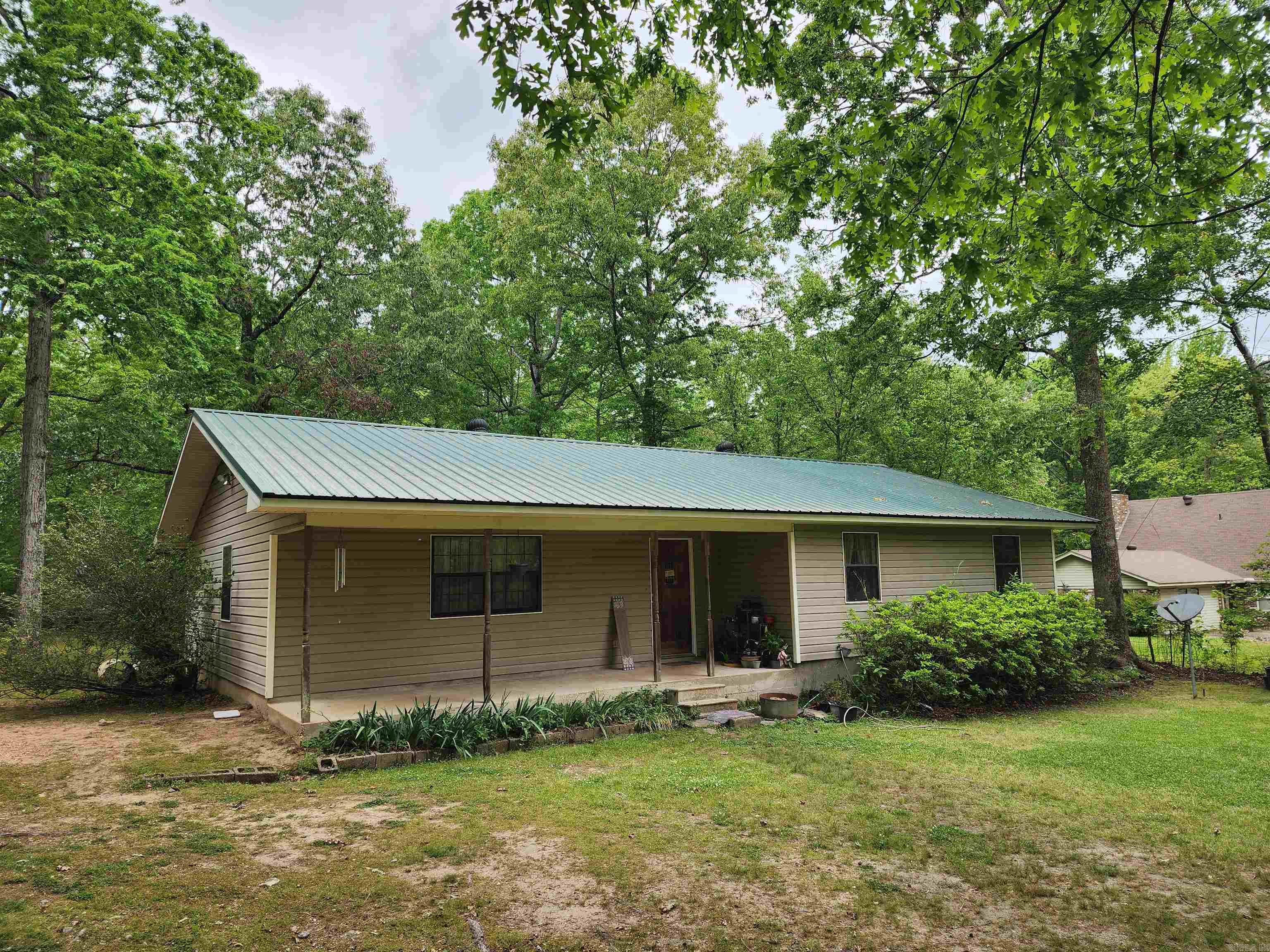 Check out this cozy 3bd/2bth home on 1.32 acres with a 20x40 insulated shop and 11x30 lean to. You can enjoy a spacious front & back porch. Metal roof is 5 years old. This home does qualify for zero down. Call for your tour today