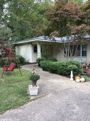 Low maintenance older home that features four bedrooms and two baths.  This is a spacious 2739 sq ft home with a large covered patio at the rear of the house.  The home has a new oven, dishwasher, hot water heater and new metal front door.  Two metal storage buildings and refrigerator remain with the property - it also has a playhouse, swing and slide that are negotiable.  Call Dianna Martinie today @ 870-500-5944 an appointment.