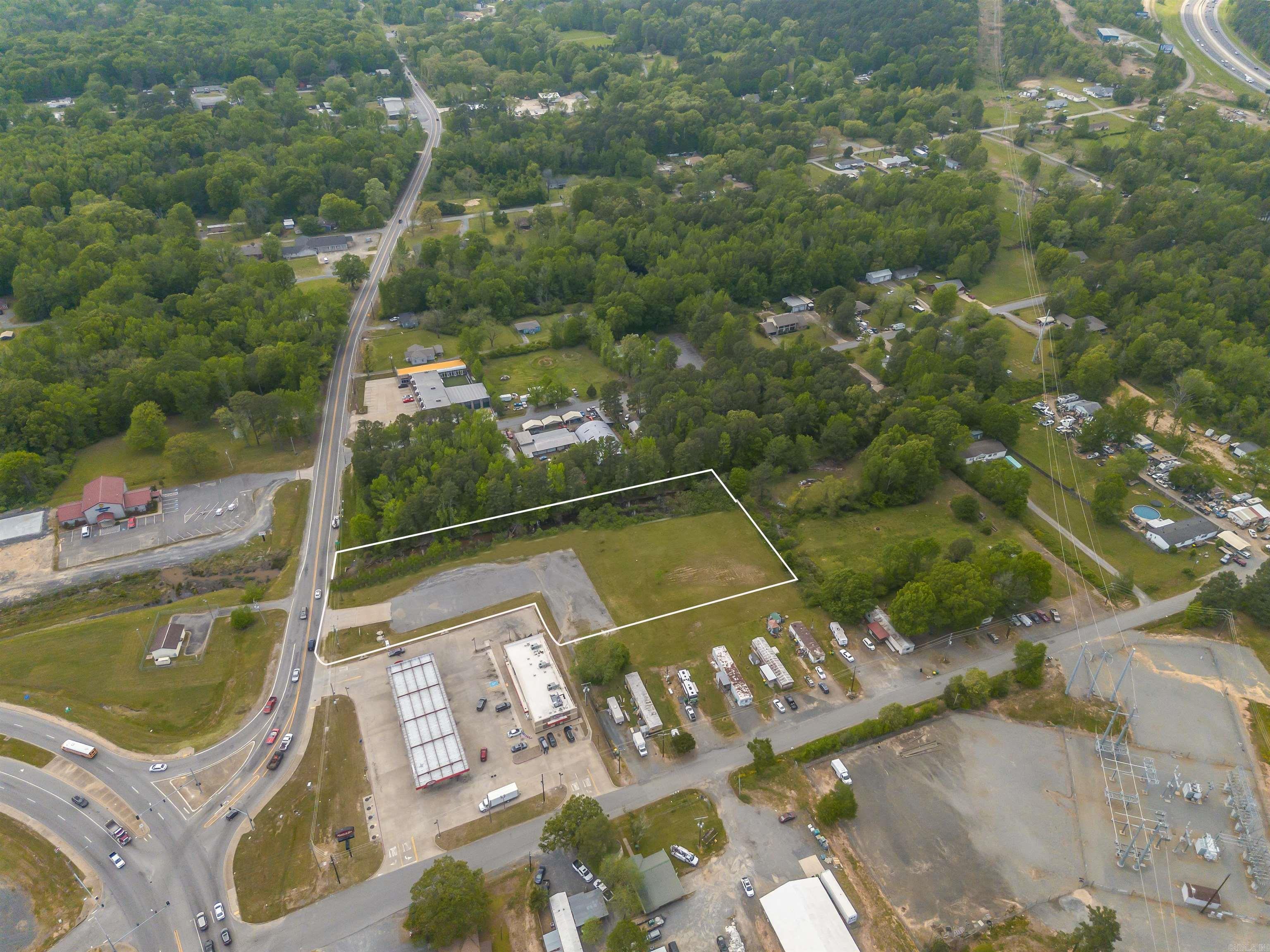 3.16 Acres Land. For Sale or Lease. Prime Real Estate Located In High Traffic Volume Area with Traffic Light Intersection on Highway 365 N and Highway 100 Going Into Maumelle. 200 FEET Frontage. Next To Maverick Fuel Station/ C-Store. I-40 Interstate Less Than 1 Mile from Exit 142. Hwy 365 is a 5 Lane Highway. Land Is Not in Extra Territorial Jurisdiction of Maumelle. Contact Pulaski County Planning Commission for development questions. 3.16 Acres Ready To Build Possible Hotel, Restaurants, Medical Office, Business Park, Strip Center, Self Storage, Bank, Retail, RV Camp Site, ETC.