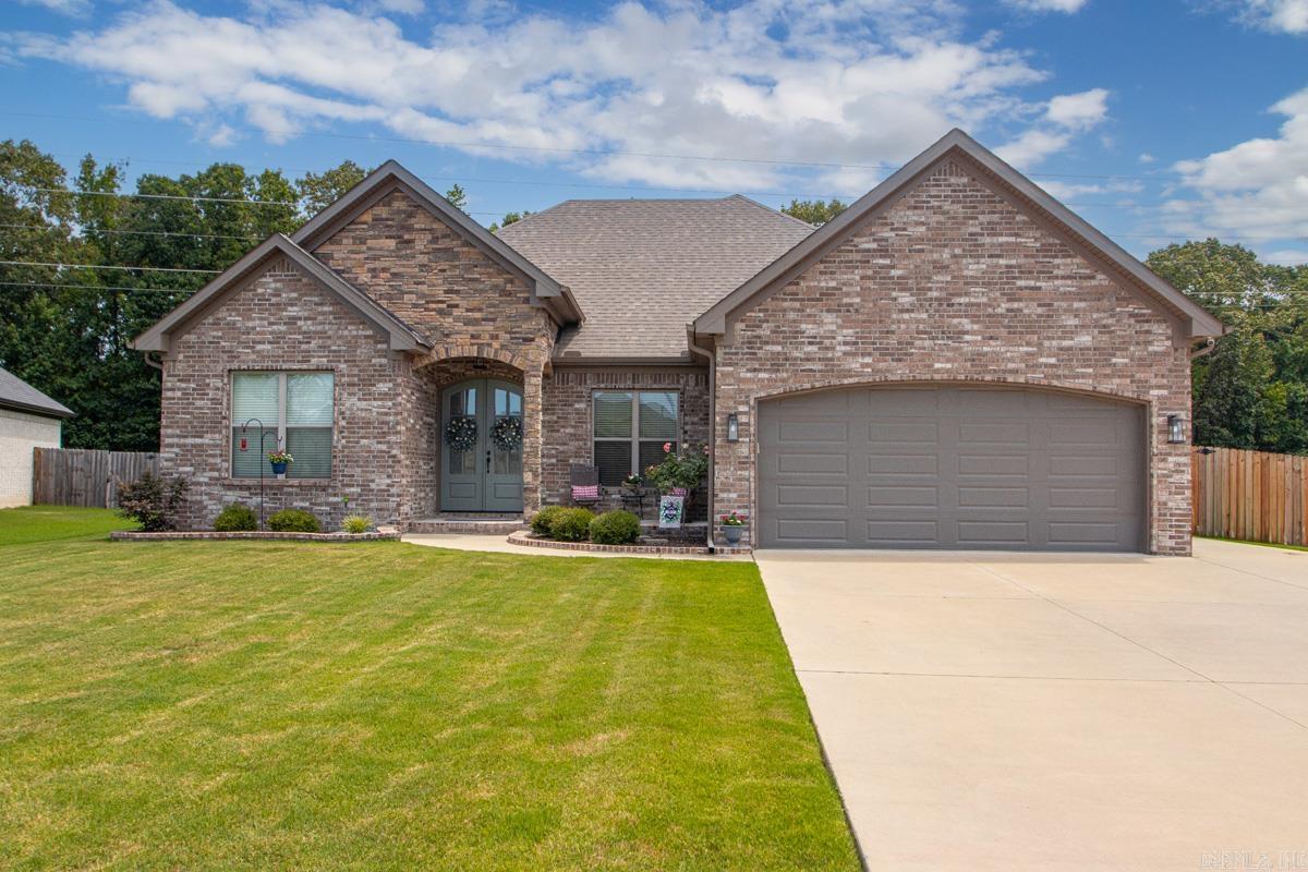 Beautiful all-brick newer home offering the perfect blend of style, comfort, and functionality! This 3-bedroom, 2.5-bath home features an open, inviting floor plan with gorgeous wood-look tile flooring throughout the main living areas, combining the beauty of hardwood with the durability of tile. The spacious primary suite includes a luxurious walk-in tile shower, and the primary closet connects directly to the laundry room for ultimate convenience. Enjoy endless hot water with the tankless water heater. Outside, you'll appreciate the extended parking pad for extra vehicles, guests, or recreational toys. The flat, fully usable backyard is perfect for kids, pets, entertaining, or relaxing with family and friends. This move-in-ready home has so much to offer—don't miss your opportunity to make it yours. Schedule your private showing today!