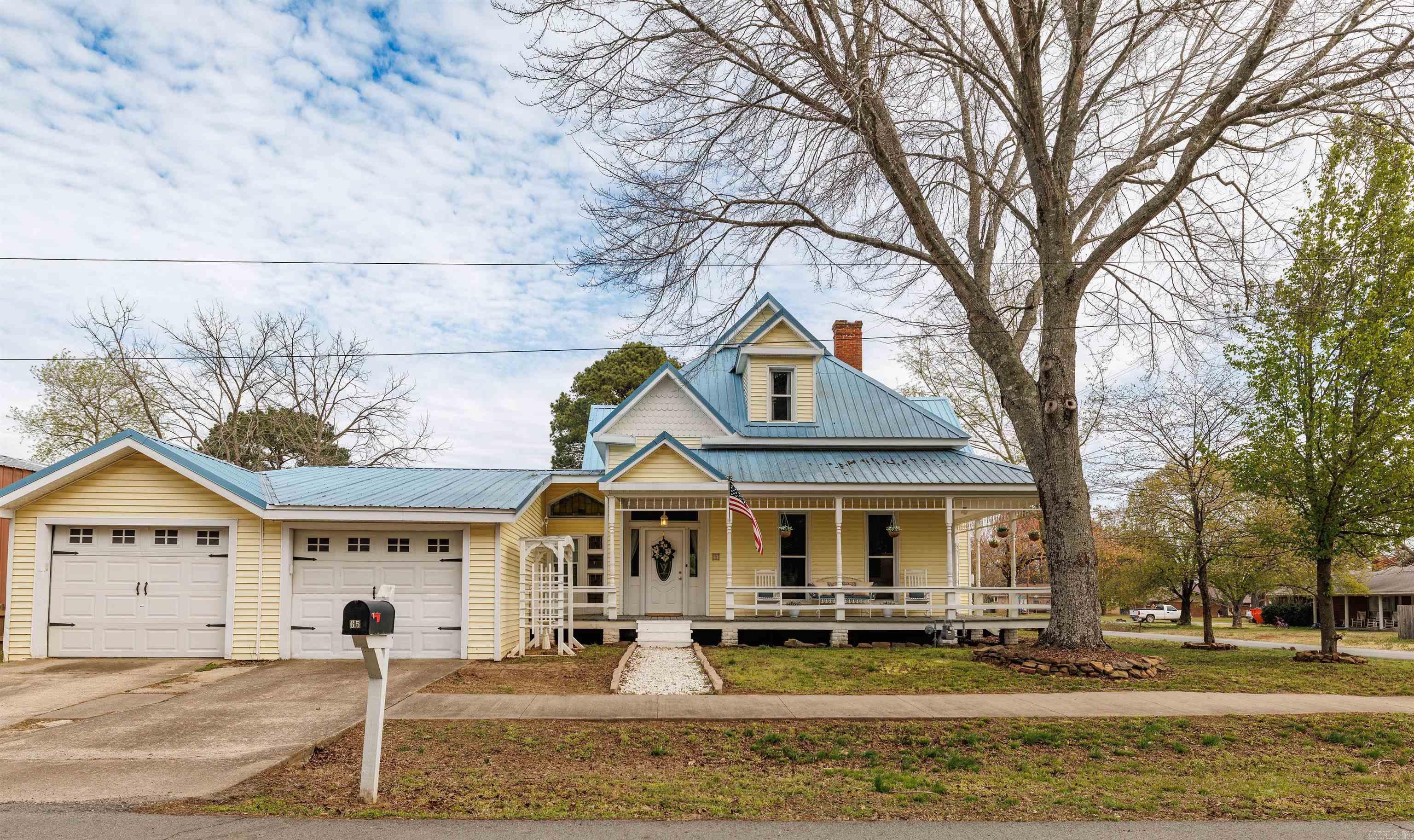 Step into a piece of history with this beautifully preserved 1891 home that perfectly blends timeless character with modern comfort. From the moment you arrive, you'll be captivated by the inviting wraparound porch, striking metal roof, and classic architectural details that make this property truly one of a kind. Inside, the grand staircase, original woodwork, soaring ceilings, and rich hardwood floors showcase the craftsmanship of a bygone era. Offering generous living spaces, this historic gem provides the perfect setting for entertaining, relaxing, and creating lasting memories. Every room tells a story while offering the warmth and charm today's buyers are searching for. Don't miss the opportunity to own a rare piece of local heritage--where historic elegance meets everyday living. Homes like this only come along once in a generation!