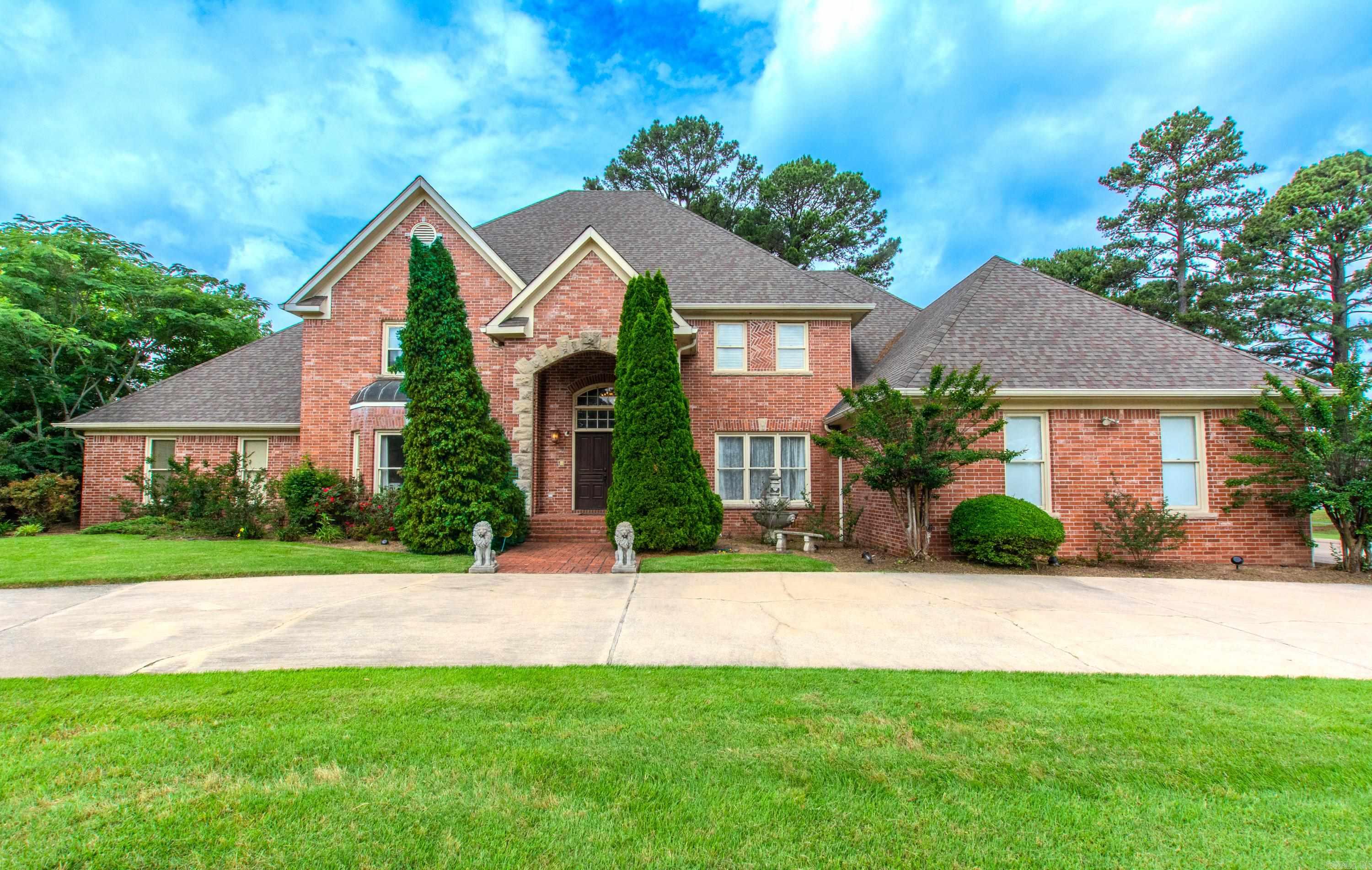 Always dreamed of living on a golf course. Here is your chance in this stunning executive home featuring 7 bedrooms & 5.5 baths, perfectly designed for both luxury living & entertaining. The 7th bedroom was thoughtfully built as an in-law suite with its own bathroom & small kitchen, but could easily serve as a playroom, media room, or theater room. The main level showcases an oversized primary suite with beautiful picture windows overlooking the golf course. The spa-like primary bath offers separate his-and-her vanities, large jetted tub, separate shower, & spacious walk-in closets. You’ll also find a formal living room, formal dining room, & an inviting den with a fireplace. The chef’s kitchen is a dream with a large center island, double ovens, tons of pull-out cabinetry, a pantry, & abundant counter space for even the pickiest cook. A sunny breakfast nook adjoins the eat-in kitchen, along with a convenient laundry room nearby.  The second level boasts 5 additional bedrooms plus the private in-law quarters, providing space for everyone.  Outside, enjoy the circular driveway, 3-car garage, and expansive back deck, all situated on Hole #2 of the Maumelle Country Club golf course.