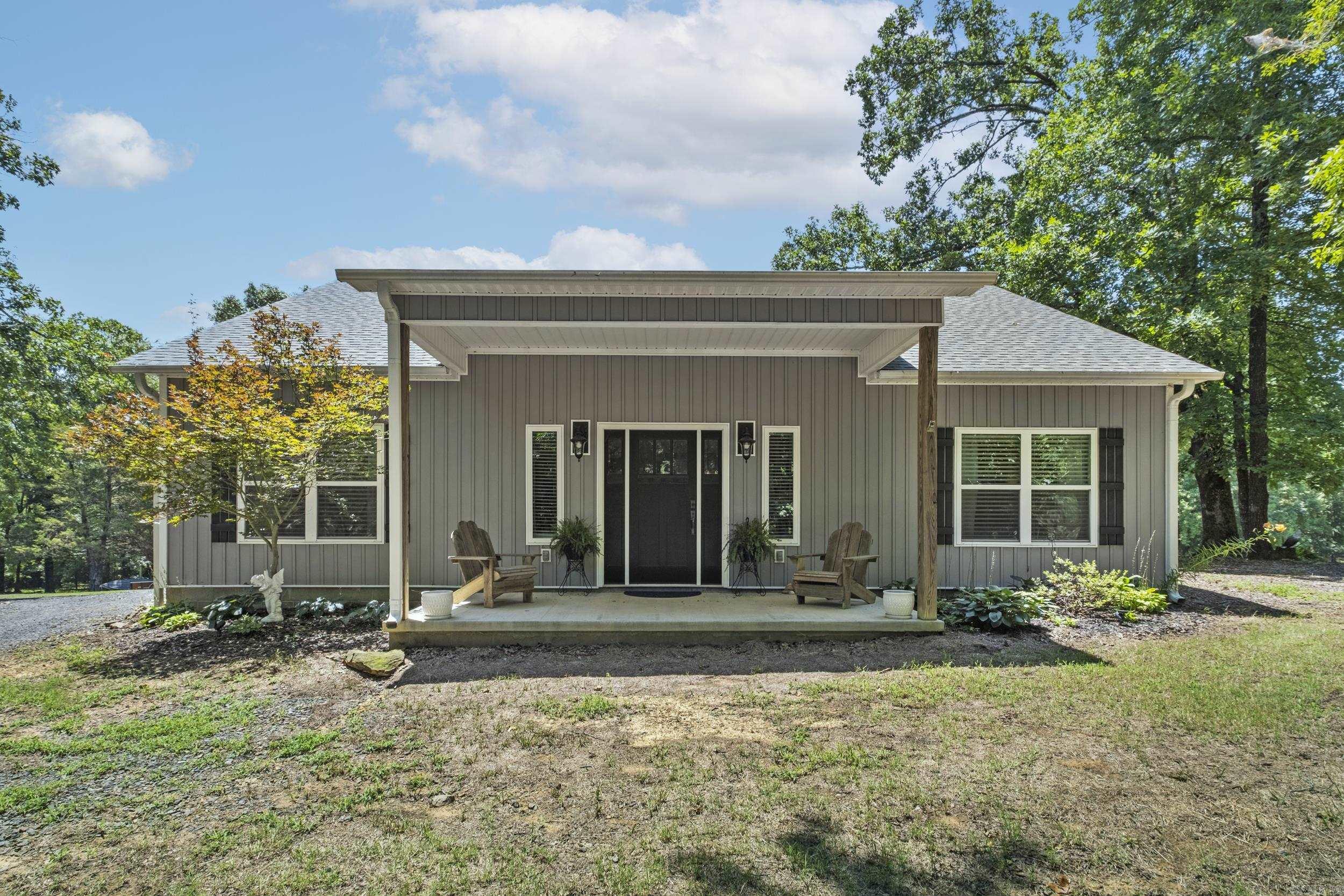 Escape to the perfect country living with this beautiful practically new home situated on 3.62 picturesque acres. Designed with both style, function and comfort in mind. This home features a spacious open concept floor plan that seamlessly connects the kitchen, dining and living area. The thoughtfully designed kitchen offers plenty of workspace and storage, complemented by a large pantry and carefully planned storage throughout the home. A large mud room adds to the convenience of everyday living. Enjoy peaceful mornings on the covered front porch and unwind in the evenings on the covered back patio where you can take in the beauty of your private acreage. Need room for hobbies, equipment, man cave or even business? You will love this impressive 30x50 Shop equipped with electric and water providing endless possibilities. Dreaming of the perfect balance this exceptional property is one you won't want to miss.