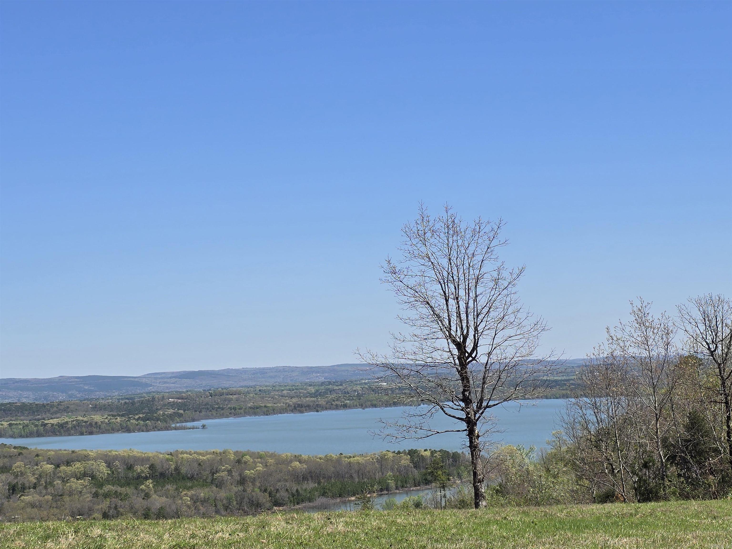 If you are looking to be on the Lake at Greers Ferry and walk out to the water for your new  retreat home .... This is the perfect lot to build on. Amazing views & Beautiful private gated neighborhood with upscale homes. Short distance to Narrows Marina and Shiloh Marina. Close to many family activities and restaurants too!  Lot 11 is available if you are looking to build a bigger home and need the extra room as well as lot 36 across the street is also available.