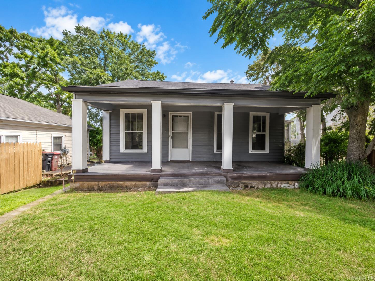 Great rental property or perfect option for a first-time home buyer in Little Rock! This home has a warm and inviting feel with original wood floors throughout the living room and bedrooms, giving the space character and charm. Renovated a few years back as a rental property, it offers a practical layout with great potential for continued use as an investment or a place to make your own. The large kitchen area provides plenty of room for everyday living, and the large laundry area off the kitchen adds extra convenience and function. The inviting covered front porch gives the home a cozy touch and is the perfect spot to relax or welcome guests. Whether you are looking to start your investment portfolio, add another rental, or purchase your first home, this property is a great opportunity in Little Rock.