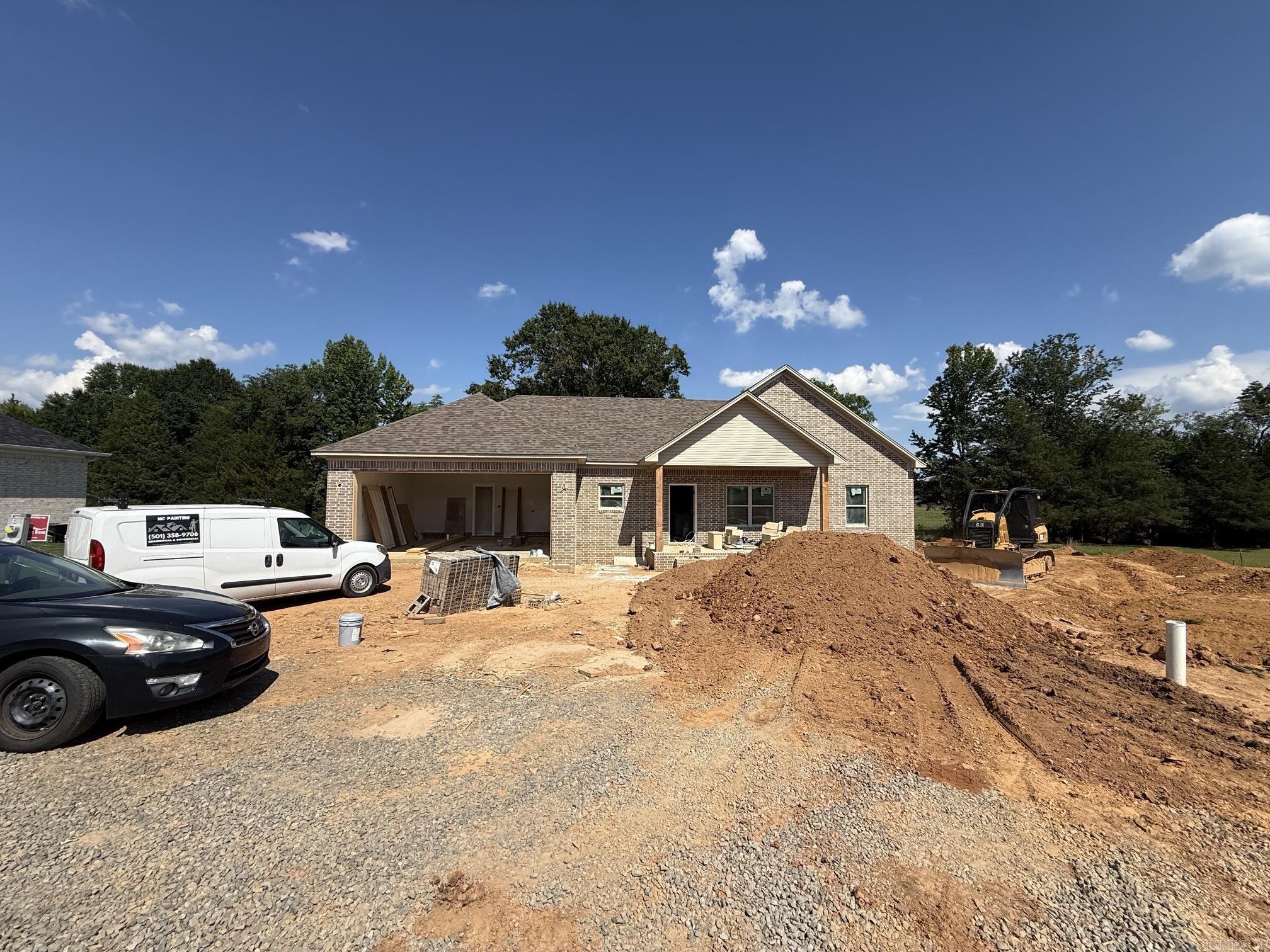 Brand-new construction offering modern comfort and timeless style! This thoughtfully designed home features an open-concept layout with a spacious living area, vaulted ceilings, and abundant natural light. The kitchen is a standout with custom cabinetry, a large center island, and a walk-in pantry—perfect for everyday living and entertaining. A cozy fireplace anchors the living space, creating a warm and inviting atmosphere. The split floor plan provides privacy, while generously sized bedrooms and well-planned storage add functionality throughout.