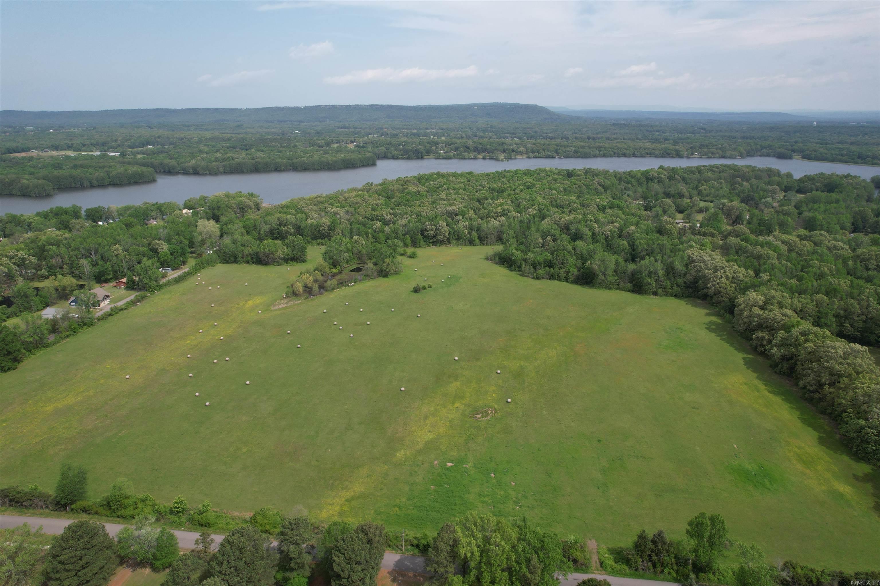 This 40 acre parcel just across the road from Lake Atkins is ideal for subdividing for a quick profit! Or build your dream home overlooking the pond on the property and be walking distance from the AGFC public access to the lake. An additional adjoining 33 acres on Lake Atkins are available for purchase as well. Mineral rights convey!