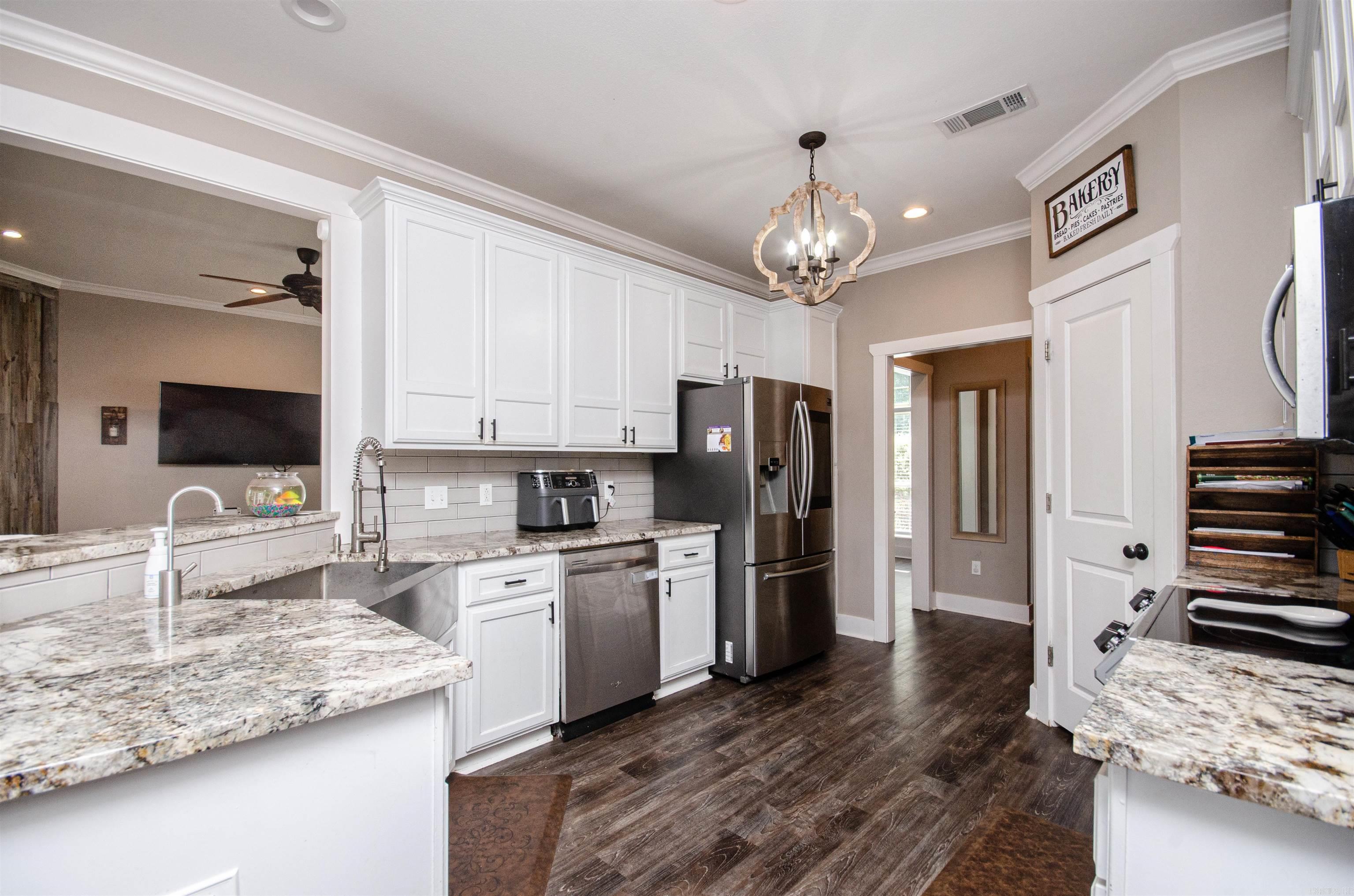 Discover your dream home in the sought-after Greenbrier School District! This beautifully updated residence, perfectly positioned on a corner lot, offers an ideal blend of comfort and convenience. Located just minutes from the city center, you'll enjoy easy access to award-winning schools, a community center, and a park, making it an ideal community. The back patio and pool area are highlights of this property. Spend your summer days lounging by the pool or hosting barbecues. This gorgeous house offers energy saving solar panel with a $13 electricity bill! Please see agent remarks.