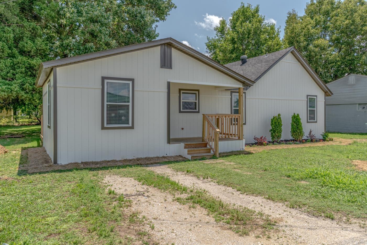 Welcome to the market 105 School St in Bay, Arkansas! This beautifully refreshed 1,238 sq ft, 3 bedroom, 1.5 bath ranch home offers a clean, modern feel from the moment you step inside. Thoughtful updates throughout give the home a sense of comfort, reliability, and readiness for its next owner. Inside, new laminate flooring, new light fixtures, and fresh interior paint brighten every room. The standout feature is the custom walk-in shower with bronze fixtures, adding a touch of luxury to this a thoughtfully designed space. A sliding glass door opens to the expansive 30' × 10' deck from the kitchen, creating an easy transition to outdoor living—perfect for quiet mornings or evenings spent with friends and family. Major system upgrades include a new electric HVAC, new insulated windows throughout, and a new electric water heater. The kitchen has been fully updated with a new refrigerator, new stove, new cabinets, custom backsplash and new dishwasher, making the home feel fresh, functional, and move-in ready from day one. Call today to schedule your tour!