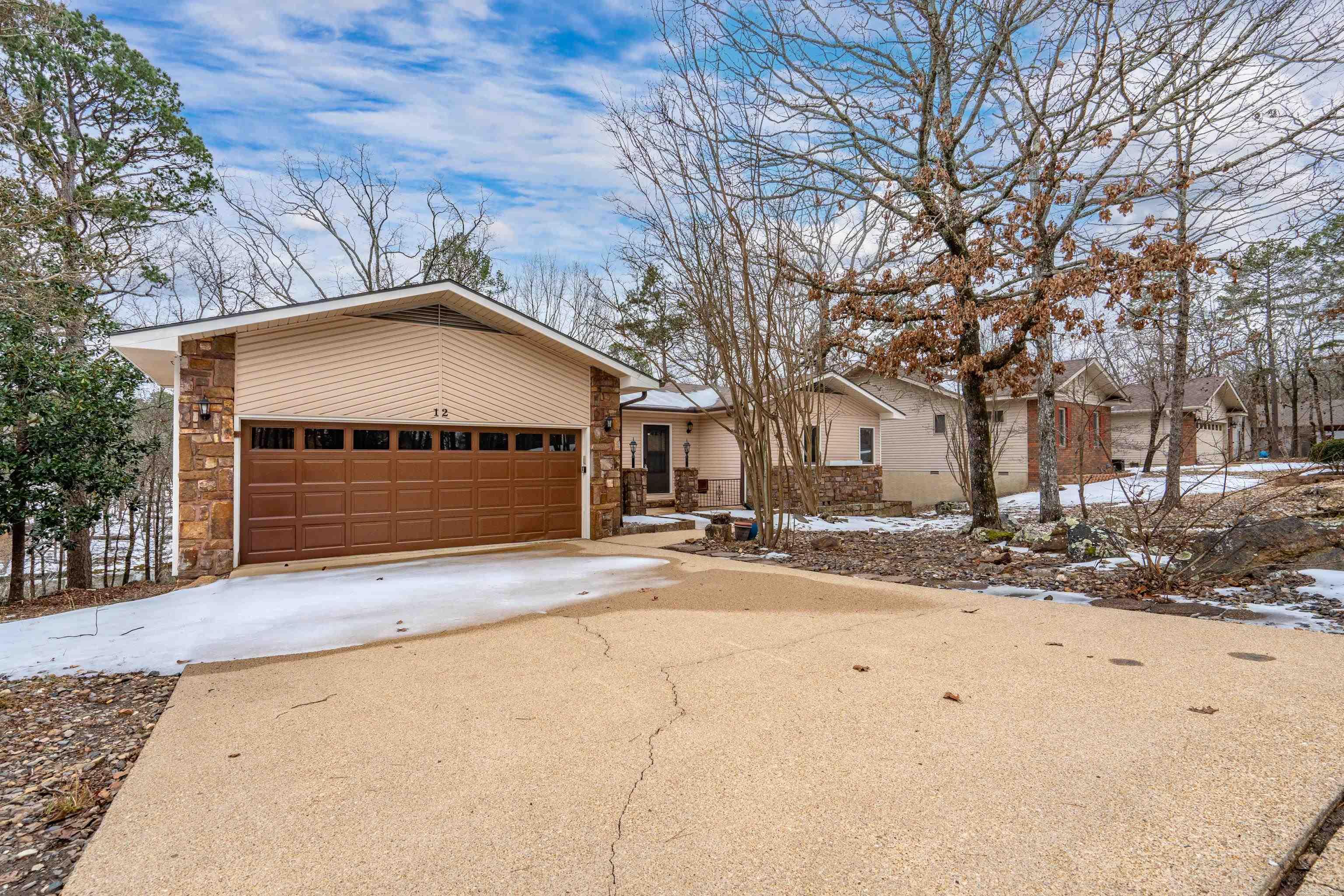 Experience true waterfront living with this beautifully remodeled lakefront home on Lake Pineda. Positioned to capture sweeping water views, this 3-bedroom, 3-bath property offers the ideal balance of comfort, functionality, and lifestyle.  Inside, the open living and dining area centers around a cozy fireplace and flows effortlessly into a sunroom designed to showcase the lake. The updated kitchen features new appliances, refreshed finishes, and durable LVP flooring that runs throughout the home, creating a clean, cohesive feel. All bathrooms have been thoughtfully updated.  The oversized laundry room includes a utility sink and abundant storage. A dedicated workshop, separate craft room, and additional storage space provide flexibility for hobbies, lake gear, or future customization.  Outdoors, the expansive deck invites grilling, entertaining, or quiet evenings overlooking the water.  Located just minutes from Village amenities, recreation, and everyday conveniences, this home offers both serenity and accessibility. Lakefront opportunities like this on Lake Pineda are limited.   Schedule your private showing and experience the lifestyle. Seller willing to pay $2,000 buy in fee.