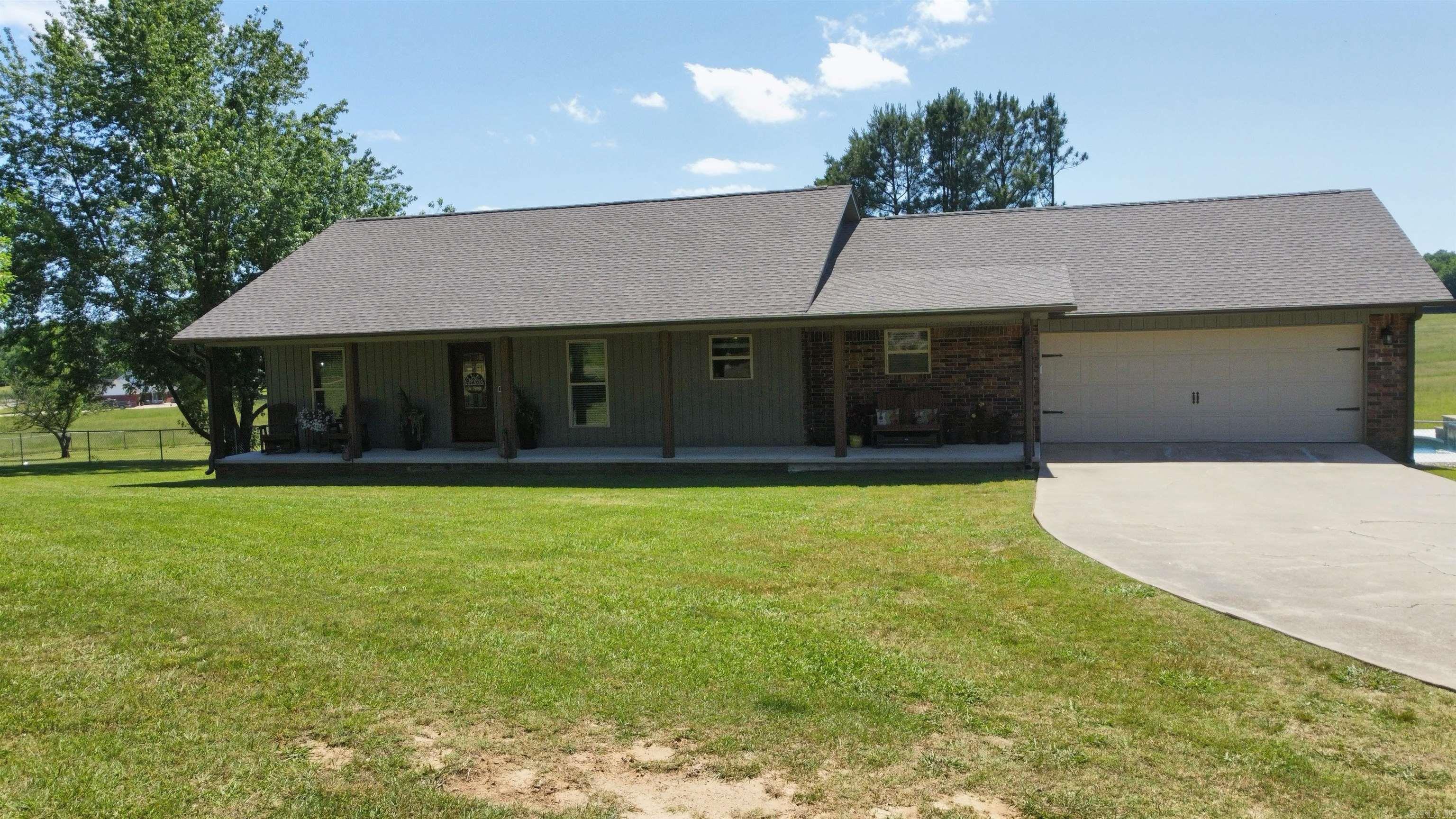 Completely remodeled and beautifully finished, this spacious home combines modern comfort with wide-open country living. Updates include new siding, windows, roof, appliances, flooring, cabinetry, and stunning granite countertops. Large closets and generous storage throughout make the layout both practical and inviting. Situated on just over 22 acres, the property is already subdivided, offering excellent potential for development, investment, or simply enjoying the space as your own private retreat. Outside you’ll find a new 30x50 shop with lean-to, an impressive inground saltwater pool with waterfall and pump house, and a large back deck perfect for entertaining. A rare opportunity with space, style, and flexibility all in one property.
