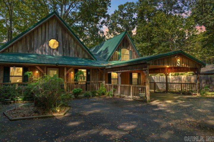 Welcome to this breathtaking riverfront custom built Cabin on the Little Red River! This home is meticulously crafted with quality and style in mind. You will always have electricity with the Guardian generator, and always be safe having the storm shelter. This property blends timeless rustic charm with upscale modern finishes and the custom built log furniture, and rustic decor, mounted fish, and turkey convey with the property. Just imagine coming home to enjoy elegant granite countertops, premium tile flooring, sky lights, and an open concept layout that maximizes natural light and showcases breathtaking river views. You will love the garden jet tub after a hard day at work. You, your family and friends will love the game room with a pool table, air hockey game, and a arcade game system that convey with this home. An expansive deck creates the perfect space for outdoor entertaining, while beautifully designed rock landscaping enhances the natural beauty. Your private dock provides direct access to the river, ideal for fishing, kayaking, or enjoying breathtaking sunsets. Pangburn is just minutes from Greers Ferry lake for even more fishing, swimming, boating, camping, and hiking!