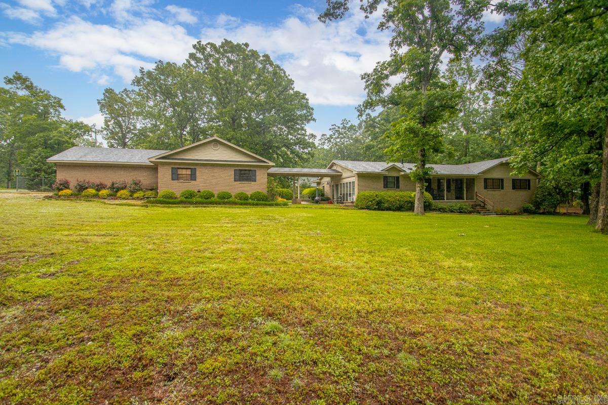 What does this property not have!? Main home, guest home, shop, pool, over 2 acres, and just seconds from the interstate and everything Bryant and Benton have to offer. Country living in town at its finest! The main home features approximately 2,300 sqft with 3 bedrooms, 2.5 baths, and a spacious primary suite complete with a walk-in shower and soaking tub. The guest home offers approximately 800 sqft and includes a full kitchen along with multiple rooms that could serve as offices, business space, guest quarters, or an in-law suite. The garage is attached to the guest home with a breezeway connecting it to the main house. And we haven’t even talked about the property itself! Sitting on a massive 2+ acre corner lot, this property offers multiple entrances, plenty of fenced space, and endless possibilities. The backyard is built for entertaining with a huge in-ground pool ready for summer fun. Need space for hobbies or work? The 40x16 shop has you covered. There are also multiple covered parking areas perfect for boats, trailers, or extra vehicles. The yard is ready for your imagination. Opportunities like this do not come often — come make this special property yours for years