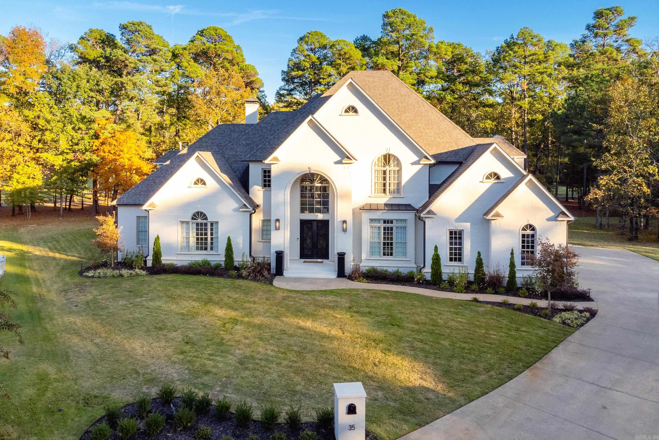 Gorgeous Chenal home nestled at the end of a cul-de-sac overlooking Bear Den Golf course. So many outstanding features in this large and beautifully updated estate home. New floors, paint and marvelous kitchen and primary bath re-models. Soaring ceilings, tall windows and plenty of natural light. Totally redesigned kitchen has large island, custom cabinetry, porcelain countertops and Hallman professional gas range. Large family hearth room with plenty of cabinets, formal and informal dining areas and impressive formal living area with views of the pool and outdoor living space. Fantastic primary suite with exquisitely updated bath. Guest bedroom suite or office also on main level. Four bedrooms up with 3.5 baths as well as theater/bonus room. 3 car side load garage, lush landscaping and much more! Come See!
