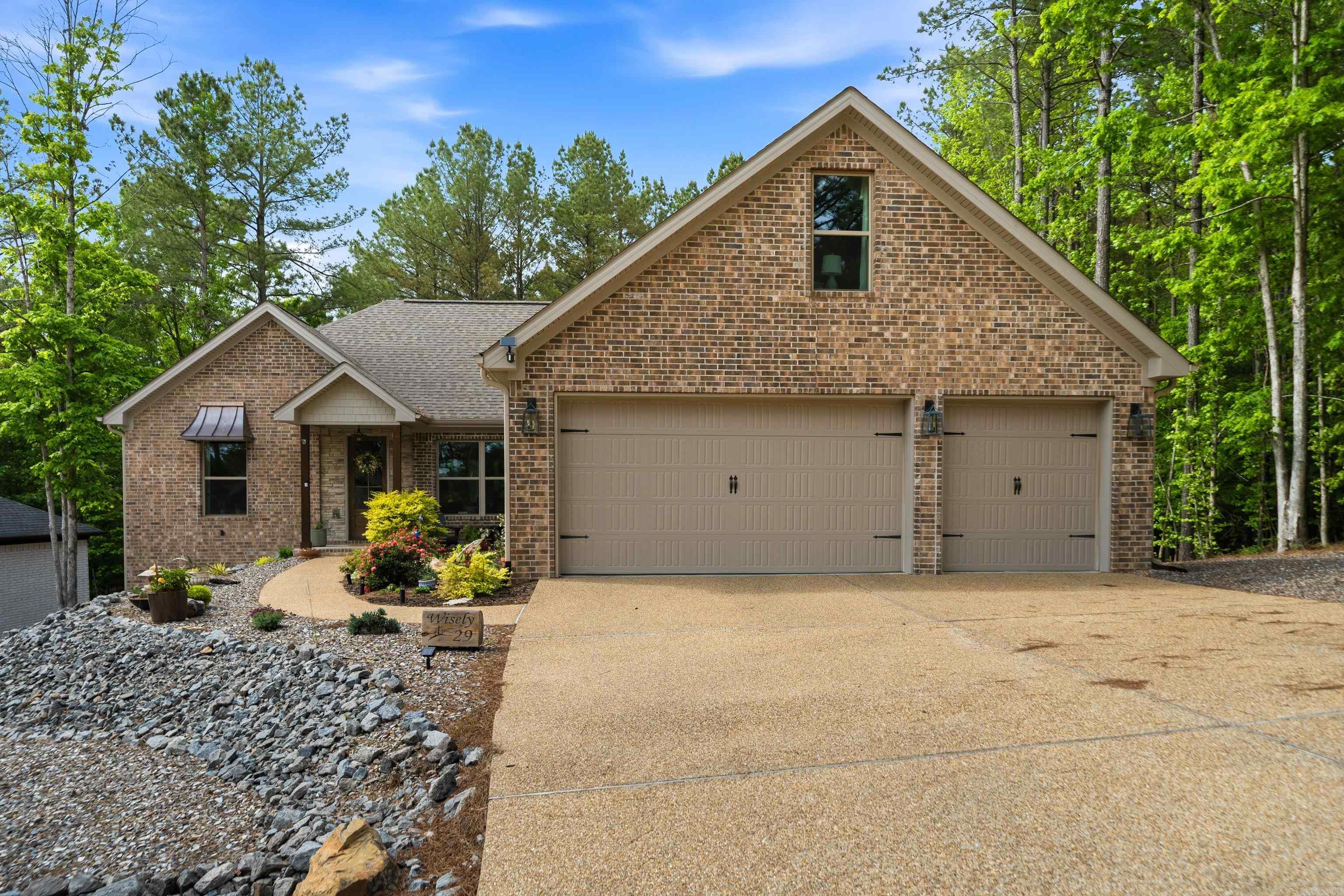 Experience the perfect blend of elegance in this custom all brick McMillan built home, ideally situated in a serene, park-like setting directly across the street from the prestigious Isabella Golf Course. The heart of the home is a magnificent, open living area anchored by a stunning fireplace and custom built-ins, creating a warm and sophisticated atmosphere.  Entertain with ease in the formal dining room or the bright eat-in kitchen featuring an expansive breakfast bar. The primary suite is a true retreat, boasting a modern walk-in shower and a generous walk-in closet, while two guest bedrooms are thoughtfully separated for maximum privacy.  The "hidden gem" is the spacious upstairs bonus level—a versatile sanctuary. Perfect for a 4th bedroom, craft room, or game room. Step outside to the wonderful, quiet deck to enjoy the surrounding nature. This quality-built retreat is a must-see for those seeking luxury and location!