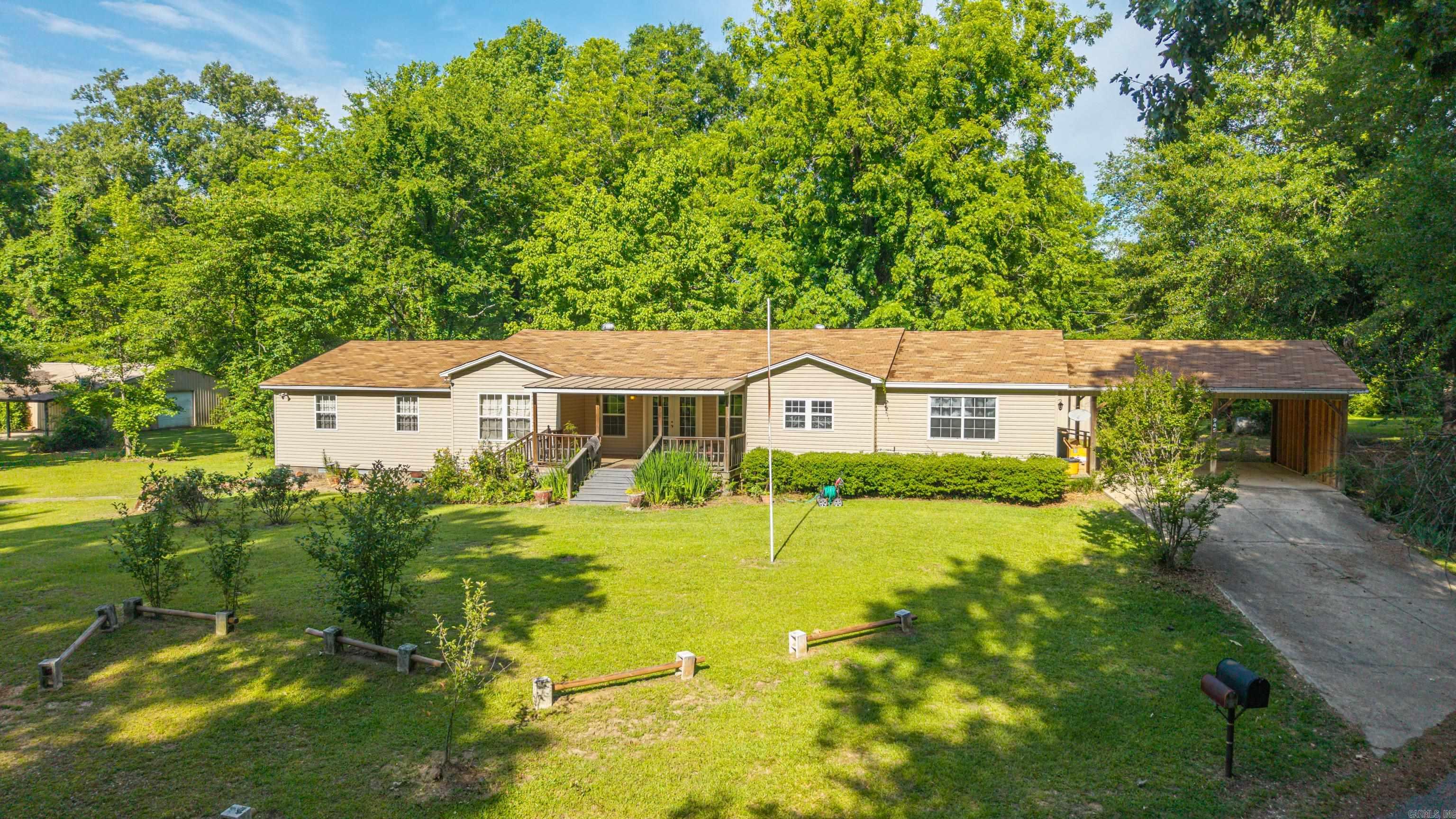 Nestled on approximately 4 beautiful acres, this homestead-style property offers the perfect blend of space, character, and convenience. Featuring 3 bedrooms, 2 bathrooms, and two versatile flex rooms ideal for an office, hobby space, guest room, or playroom, this home provides room for everyone. The oversized dining room is perfect for gatherings and entertaining. New appliances! Outside, you’ll find a large shop, additional storage building, mature shade trees, and an abundance of colorful flowers that create a nice country setting. Enjoy the feel of rural living while remaining conveniently located near the interstate, local amenities, and the universities in Arkadelphia. Whether you’re looking for a new home, hobby farm feel, or simply extra space to spread out, this property is full of potential and charm.