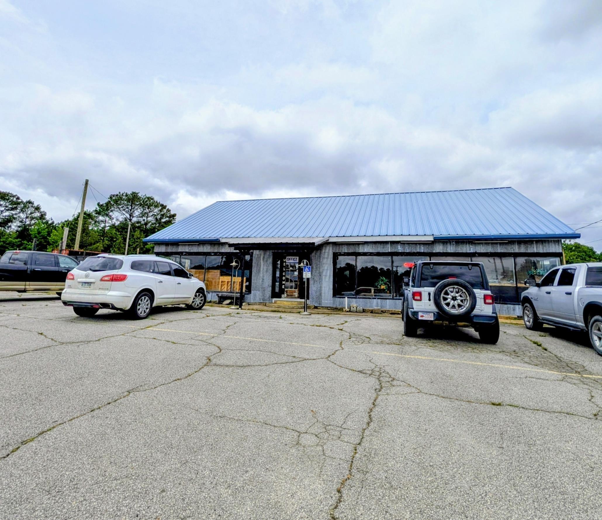OWNER FINANCING AVAILABLE with flexible terms!  Incredible commercial opportunity directly across from the brand-new, high-traffic Casey's General Store corridor! This massive 6,000 sq ft building sits on a premier Hwy 71 Prime commercial opportunity in the heart of Mena's growing business corridor! Positioned at the high-visibility corner of Hwy 71 and Reeves, this building offers exceptional exposure and unlimited potential for investors, entrepreneurs, or expanding businesses. As Mena continues to grow with increasing tourism, outdoor recreation, and the highly anticipated bike trail development, this location is perfectly positioned to capitalize on the area's momentum. Ideal for a bike shop, brewery, warehouse, retail space, industrial use, service business, or redevelopment opportunity. High daily traffic count and signal-light exposure make this one of the most recognizable commercial corners in town. Whether you're looking to launch a new venture, expand your portfolio, or secure a strategic commercial location in Mena, this property delivers opportunity, visibility, and potential. Priced to sell and ready for its next chapter!