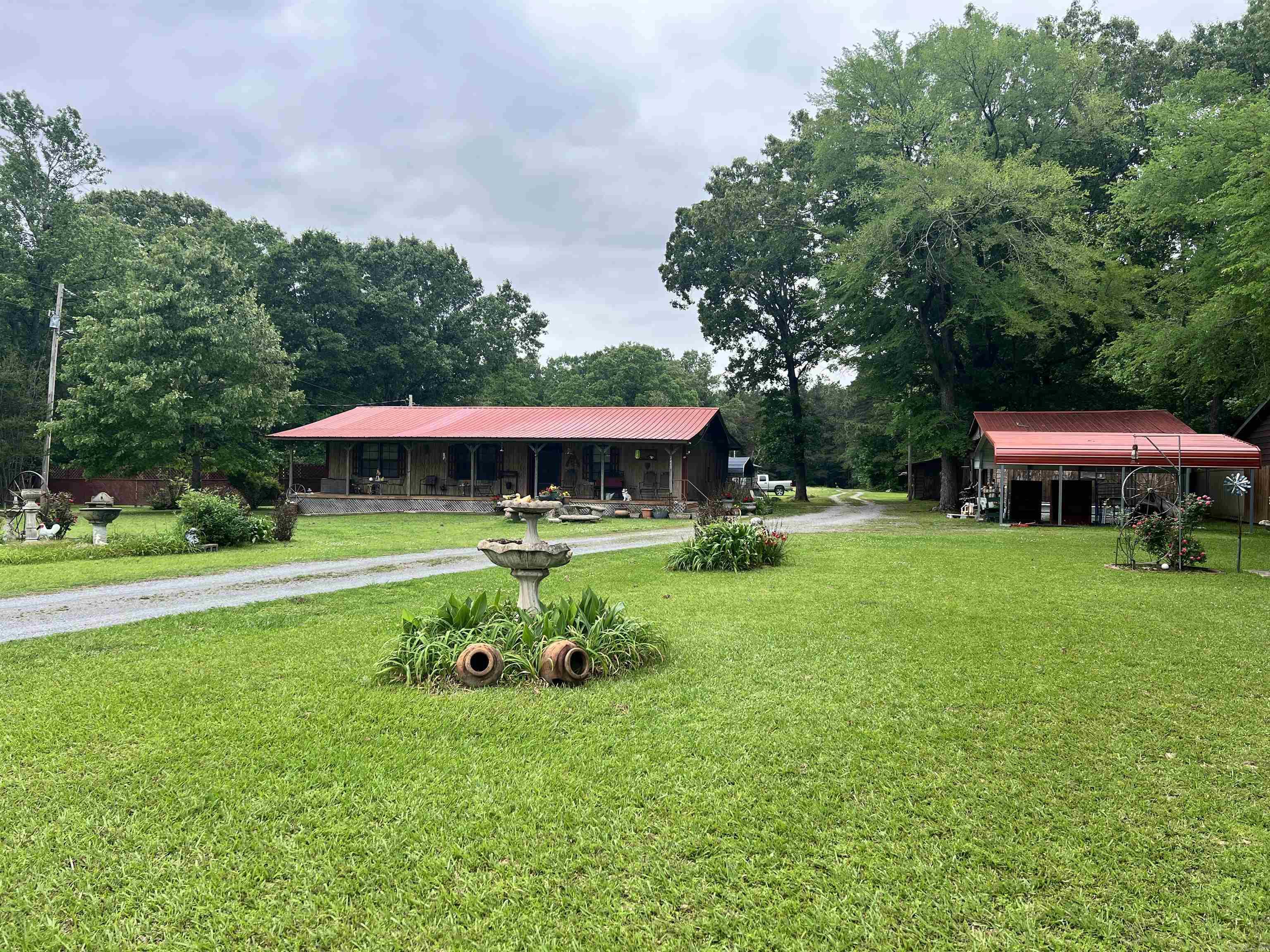 Peaceful country living on 9 acres! This unique property features two mobile homes plus multiple outbuildings perfect for a she shed, man cave, holiday storage, workshop, or hobby space.  The main home offers 1,824 sq ft with 3 bedrooms plus an office or the option for 4 bedrooms, along with 2 full baths. The second home offers 1,216 sq ft, 3 bedrooms, and 2 bathrooms—perfect for extended family, guests, or instant rental income.  Located at 2471 State Highway 212 W, Star City, this property is a great setup for homesteading, investing, or simply enjoying space, privacy, and peace.
