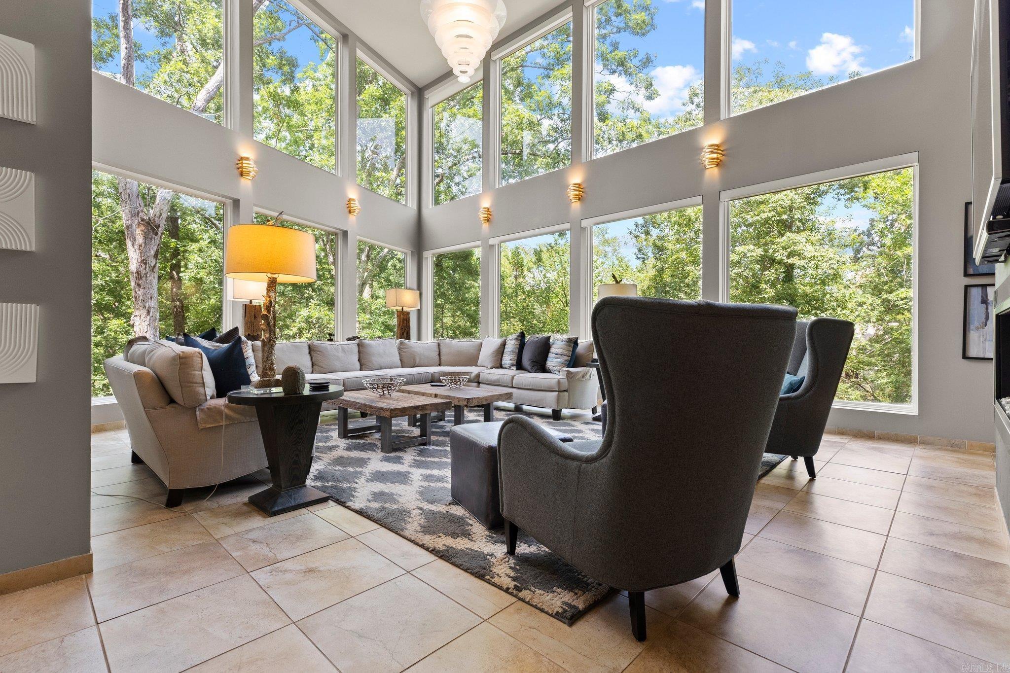 Prepare to be awestruck by this architectural marvel nestled in nature's embrace! This cutting-edge contemporary home seamlessly blends with its breathtaking surroundings of the historic Hillcrest neighborhood, offering a living experience that's nothing short of extraordinary. Step inside and be captivated by sweeping open spaces flooded with natural light, a culinary haven for aspiring chefs and entertainers alike. Your private cinema stands ready for unforgettable movie nights. Four luxurious bedroom suites, including a spa-inspired primary retreat. But wait, there's more! Ascend to the crowning glory – a rooftop oasis boasting  panoramic views of Allsopp Park complete with a bubbling hot tub for ultimate relaxation. The rich IPE wood decking set this home apart. This SMART home leaves no stone unturned in the pursuit of luxury.  Sleek glass railings for unobstructed view. The home includes state-of-the-art audio throughout and countless other premium upgrades. Effortlessly navigate all four levels via the built-in elevator. This isn't just a house – it's a masterpiece designed for those who demand the extraordinary. Your dream of modern luxury living awaits! See agent remarks