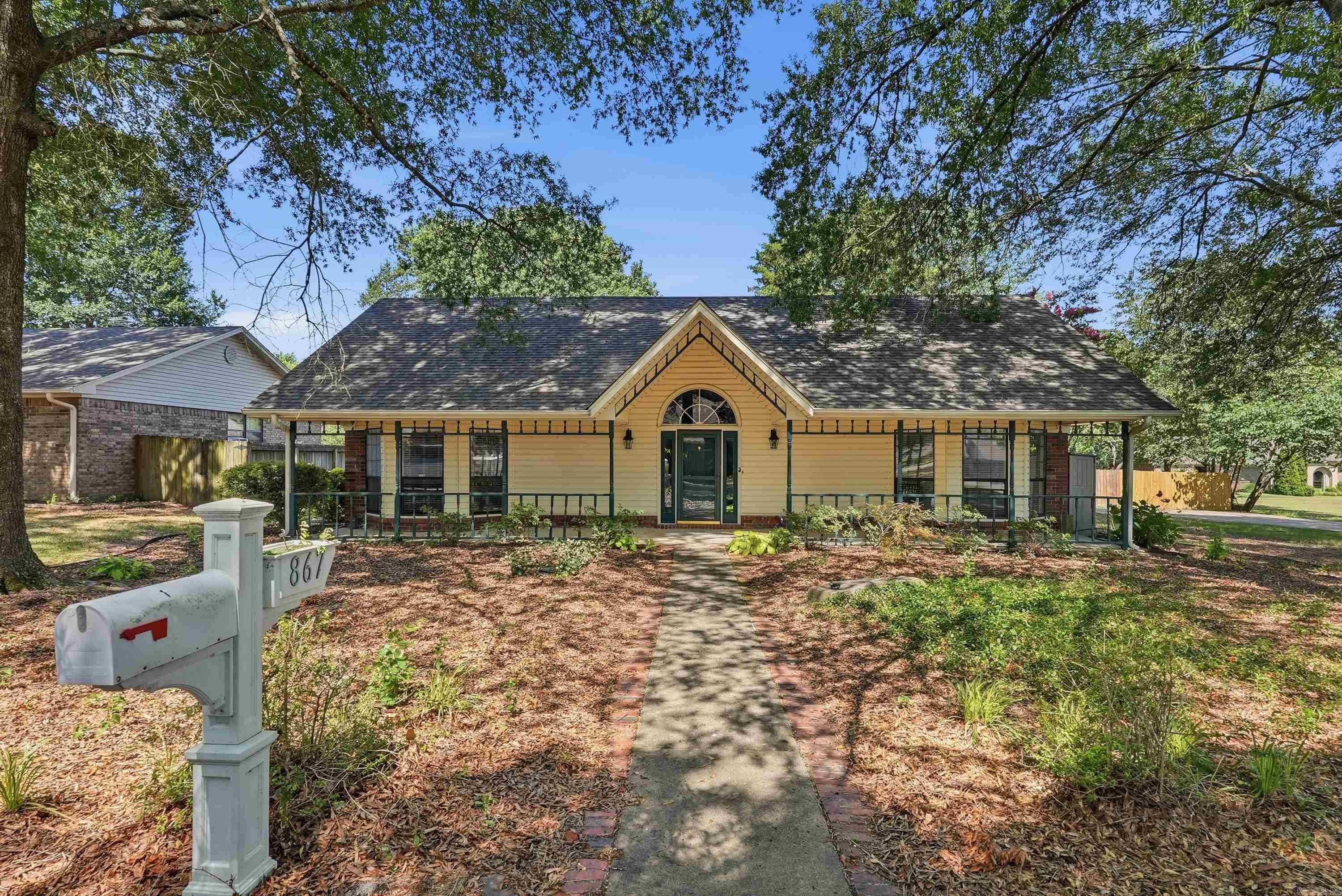 Welcome home to this spacious 3-bedroom, 2-bath home nestled in the desirable Rosewood Terrace subdivision, an established, quiet neighborhood with no through traffic, yet within walking distance of shopping, restaurants, and the scenic Tucker Creek Trail system. Relax on the large front porch, perfect for rocking chairs and visiting with neighbors.  Inside, the inviting great room features soaring vaulted ceilings, a cozy wood-burning fireplace, and double French doors leading to a large deck that's ideal for entertaining. The kitchen offers solid wood cabinetry and flows into the spacious dining room with a beautiful bay window. All three bedrooms are generously sized, while the primary suite provides private deck access and an ensuite bath with a large soaking tub, separate shower, and dual vanities. Outside, you'll find a large shaded backyard and an oversized detached garage with plenty of room for vehicles, storage, or a workshop. Updates include new carpet, a 4 yr old roof, and a whole-house water filtration system installed in 2023.  Schedule your showing today ...this one won't last long!