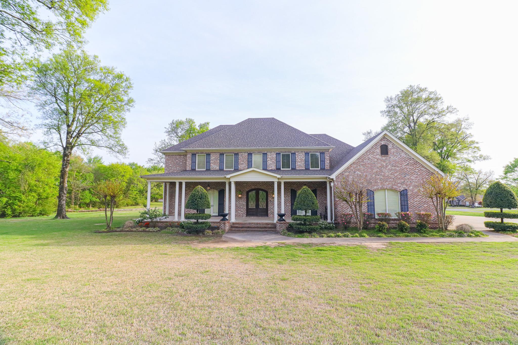 I'm thrilled to introduce an extraordinary property that represents the pinnacle of luxury living in Northeast Arkansas. This breathtaking all-brick 2-story home, nestled on a sprawling 3.86-acre lot, offers an unparalleled living experience with over 4,800 square feet of meticulously designed space. Boasting 5 generously sized bedrooms and 4 full bathrooms, this estate provides ample room for family living, entertaining, and creating lasting memories. The home's interior is a testament to refined taste, featuring a beautiful mix of flooring materials including rich hardwood, plush carpet, and elegant ceramic tiles that flow seamlessly throughout the living spaces. The heart of this home is undoubtedly the gourmet kitchen, a culinary enthusiast's dream equipped with a professional-grade Thermador 48 Dual-Fuel Cooktop, sophisticated gas oven, impressive 48 Vent-a-hood, and a stunning GE Monogram 48 counter-depth refrigerator that combines style and functionality. Comfort and ambiance are enhanced by a warm gas fireplace, perfect for cozy evenings and creating a welcoming atmosphere.