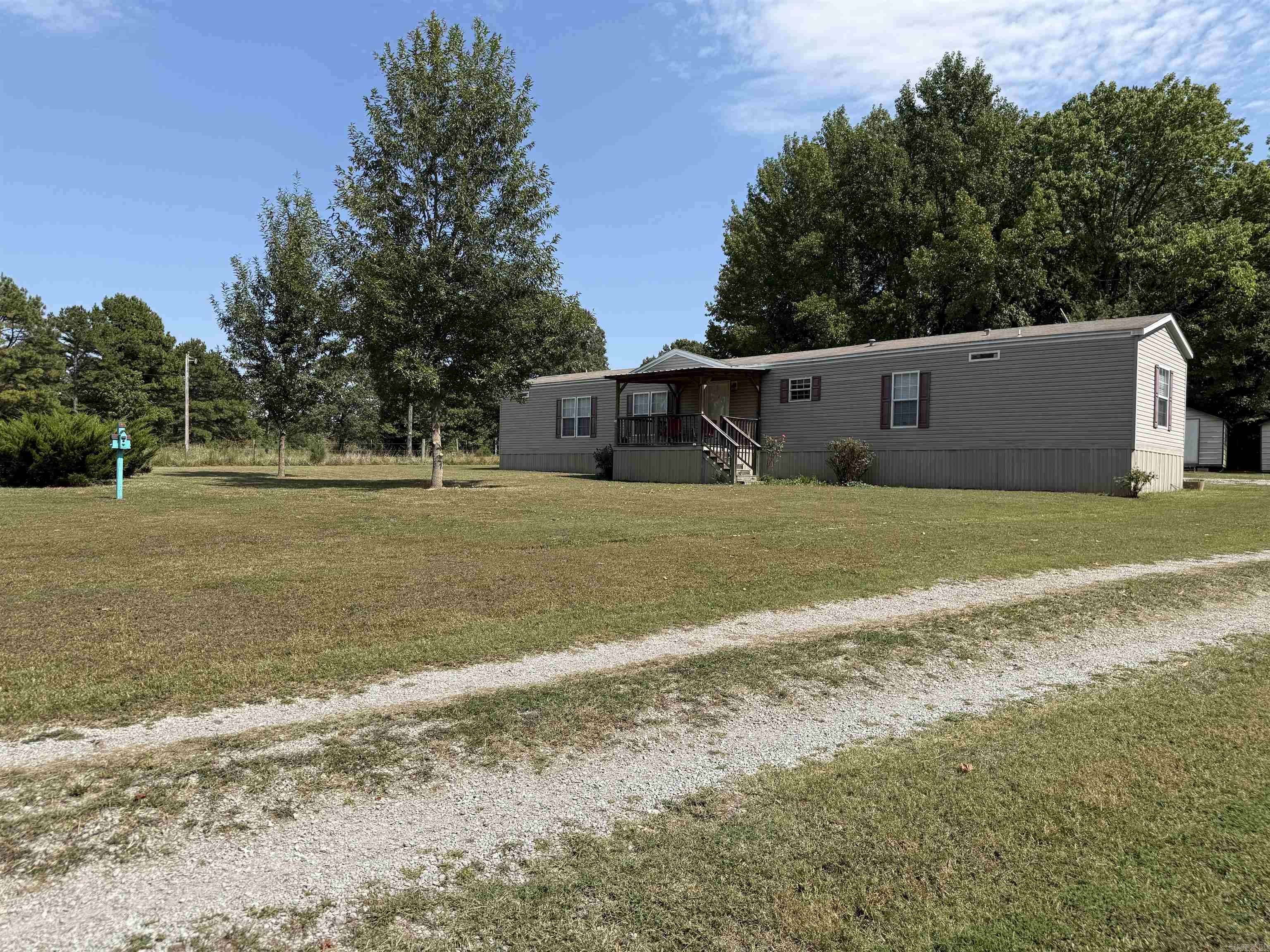 Looking for a move-in ready home without breaking the bank? This well-maintained manufactured home offering 1,312 sq ft of single-story living located at 701 WPA Rd, Sulphur Rock is it! Home offers 3 bedrooms, 2 bath. Master bathroom features a large bathtub, separate walk-in shower & double vanity. With a double carport, a private deck for enjoying the outdoors, and the practical layout, it’s just right for those wanting comfort and value. 2 storage buildings also stay on the property, perfect for all those extra storage needs! Property is also equipped with a large storm cellar.