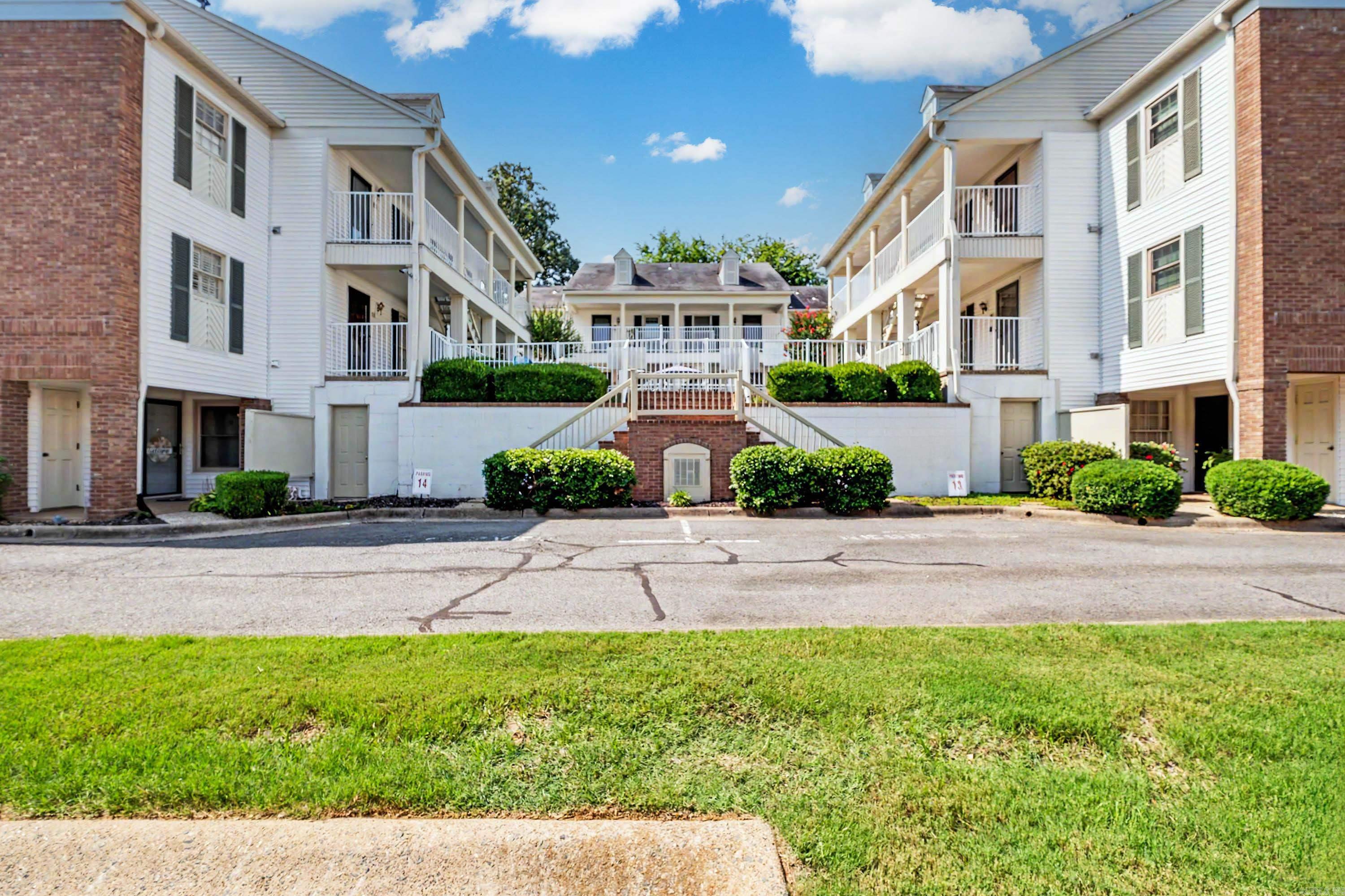 Charming condo near UAMS, dining, and parks, with private front and back porches. The updated kitchen opens to a cozy living/dining area with hardwood floors and a gas fireplace. The primary suite offers a jetted tub, walk-in shower, double vanity, and huge closet with laundry access. A second bedroom with its own half bath makes a great office, gym, or studio. Low maintenance living, with shared in ground pool in prime Little Rock location, don't miss it!