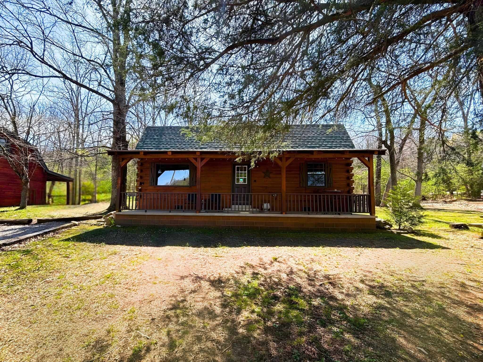 CABIN #2 is a charming two-story retreat offering 1,408 sq ft of space. It includes 2 bedrooms and a spacious loft area that can accommodate extra beds to be used as a 3rd bedroom or flex room, along with 2.5 bathrooms. The open concept living and dining area flows seamlessly into a fully equipped kitchen, complete with a washer and dryer. Cozy up next to the free-standing wood stove or relax on one of the two covered porches.  Can be leased fully furnished for an additional $300 per month.