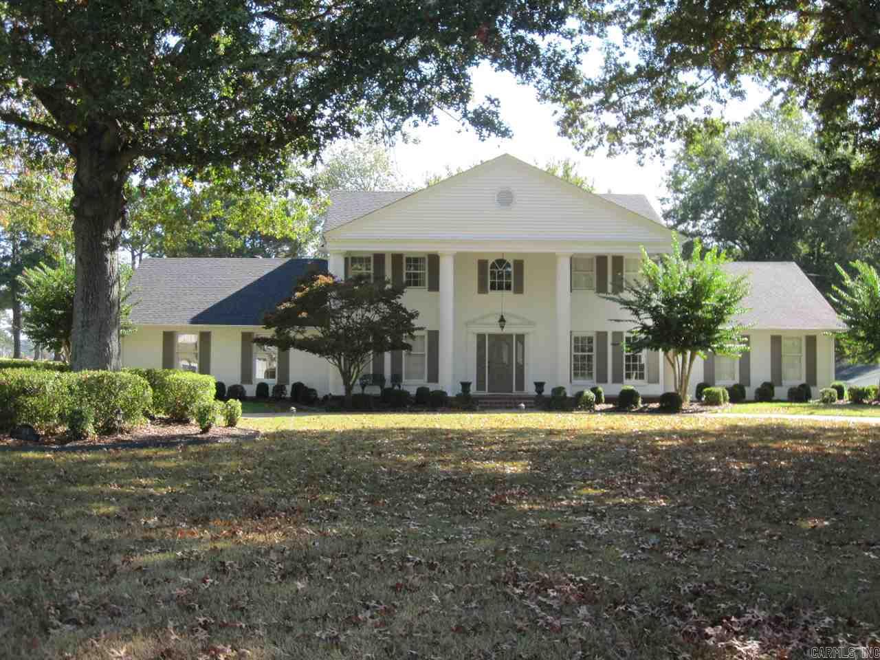 TAKE A BETTER LOOK AT this beautiful home located on the Searcy Country Club golf course.Home features over 3100 sq. ft., 4 bedrooms,3.5 baths. Gracious foyer has circular staircase leading to upper & lower levels.Spacious kitchen w/plenty of natural light, cabinetry & counter space.Separate dining room, large laundry room with abundance of storage.Three living areas,2 gas log fireplaces, large spacious sunroom,updated bathrooms, master suites upstairs & downstairs.Roof & heat/air replaced 2017. Call today!