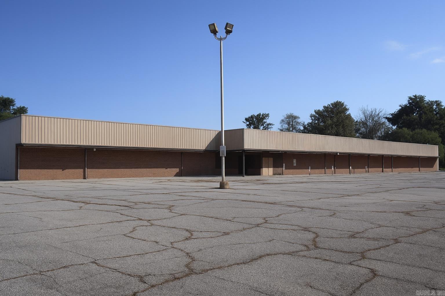 Discover a rare commercial opportunity in the heart of Blytheville! This spacious building, formerly home to a Price Chopper grocery store, offers endless potential for redevelopment or business expansion. Featuring a large open floor plan, high ceilings, and ample square footage, the property is ideal for retail, warehouse, office conversion, or mixed-use possibilities. Situated on a highly visible road with convenient parking, it's perfectly positioned to serve as an anchor property in the community. Whether you're an investor, entrepreneur, or developer, this property provides the flexibility and footprint to bring your vision to life in a growing small- town market.