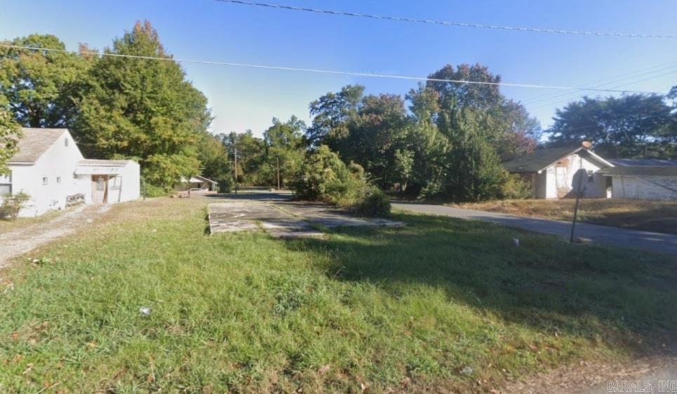Build a new home on this .18 (+/-) acre corner lot in Pine Bluff of Jefferson County. A concrete pad is already in place along with a 10-spot paved parking lot. The lot is level and cleared, and only minutes away from Lake Saracen and the Arkansas River. Manufactured homes are not allowed. Owner financing is available. Property conveys a Limited Warranty Deed. Call or text for more information.