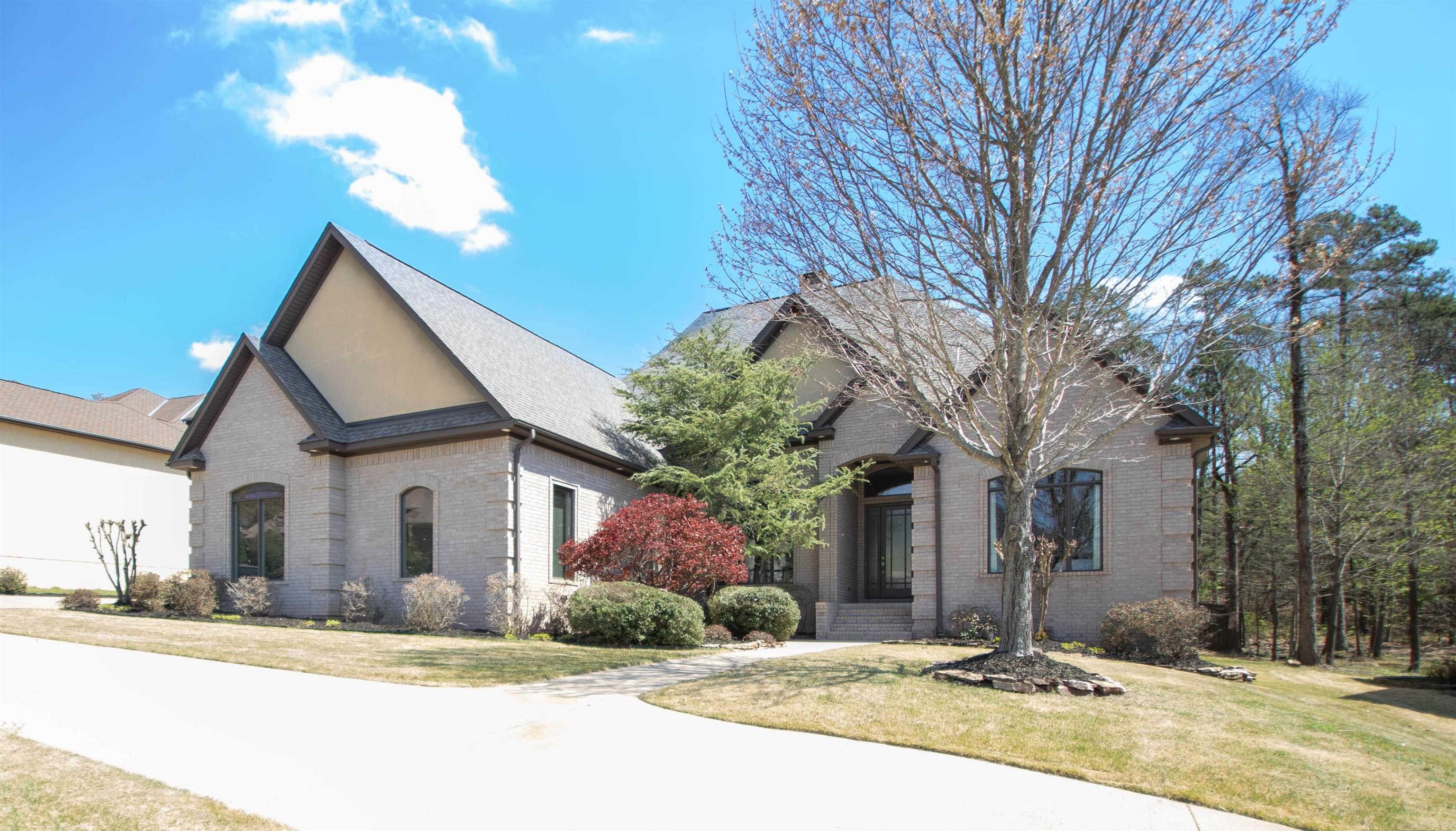 Beautiful custom home with 4 beds/3 baths/3 living areas/2 dining/theater room/3 car insulated garage.  All bedrooms on first floor. New roof as of March 2026. The home has many upgrades including cherry cabinetry in kitchen and bathrooms as well as quartz counters throughout. Kitchen has a Thermador gas cooktop, commercial type separate refrigerator and freezer, island with prep sink and large breakfast bar that seats 6. Bedrooms are spacious with custom closets in each. Primary bedroom is very large with a nice sitting area.  Primary bath has an air therapy tub and a huge walk in shower with multiple water features. There is a theater room with profesionally installed equipment and a huge playroom/music room over the 3 car garage. See Documents section for specifics on 2 gas tankless water heaters and 3 zone HVAC system.  Wonderful neighborhood with a cut through for golf carts to Chenal Golf course and close to popular Promenade restaurants.