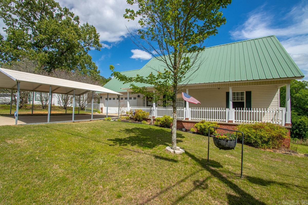 Welcome to 141 Couchwood Terrace! Enjoy peaceful lake-area living in this charming 3 bedroom, 2 bathroom home in Hot Springs featuring beautiful water views of Lake Catherine! The 3rd bedroom does not have a closet, but would still make a great bedroom, bonus room, office, craft room, or guest area. There's so many options!! Relax or entertain on the large deck overlooking the water, offering the ideal spot to enjoy morning coffee or evening sunsets. This beautiful home is a great opportunity for anyone looking for comfort, scenery, and tranquility. Large floored attic for plenty of storage!! Washer, Dryer, Kitchen refrigerator, and hot tub will stay with the home!! Don't miss out on this quiet oasis!! Schedule your showing today!! PLEASE SEE AGENT REMARKS!! ** SOME PICTURES HAVE BEEN VIRTUALLY STAGED. FURNITURE AND DECOR SHOWN ARE FOR ILLUSTRATIVE PURPOSES ONLY!!**