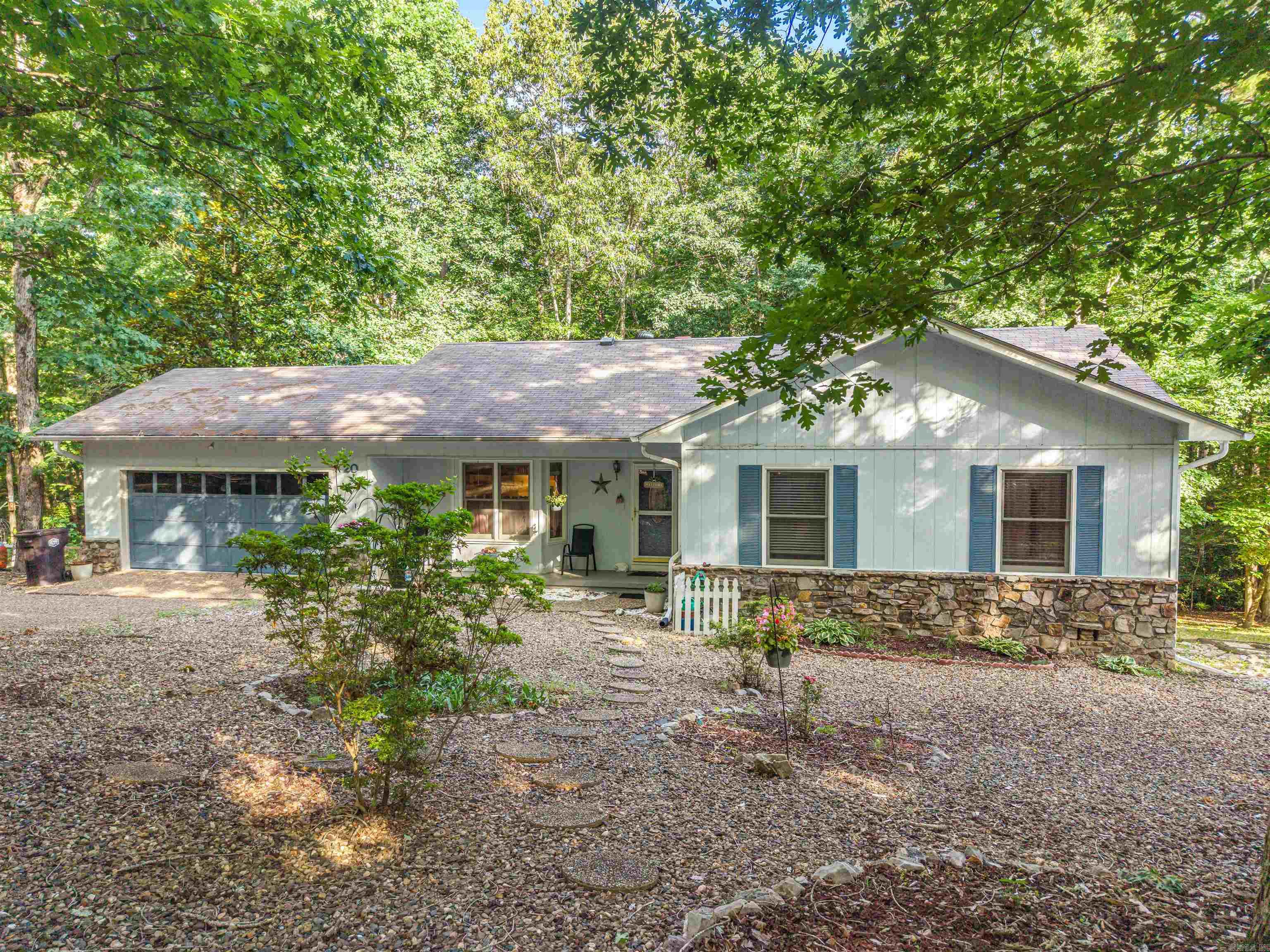 You will love this CHARMING updated 3 bed 2 bath home in beautiful Hot Springs Village. Located just a hop, skip, and a jump from fishing at Lake Segovia or golfing at Desoto Golf Course, this home is the perfect place to call home sweet home or your home away from home! Spacious open-living areas including a roomy sunroom with cozy wood fireplace and an attached deck with a scenic wooded view makes for relaxing days.  The primary en-suite has large his and hers closets and a walk-in shower.  The large guest rooms provide space for company or a home office. You will also enjoy built-ins throughout the home including a sizeable pantry. The 2 car garage has added space for storage. The laundry room has additional cabinetry and its own sink. Do not miss the workspace and man-cave around back! Many upgrades and updates have been made in the past few years including: New paint inside and out in 2022, Upgraded plumbing in 2019, New Hot Water Heater in 2019, New Armstrong Luxury Plank Flooring in 2019, New Carpet in 2019, New Roof, New Skylights, New Turbines and New Flashing in 2016. Sellers are very motivated to get this one sold! Call me for your personal showing TODAY!