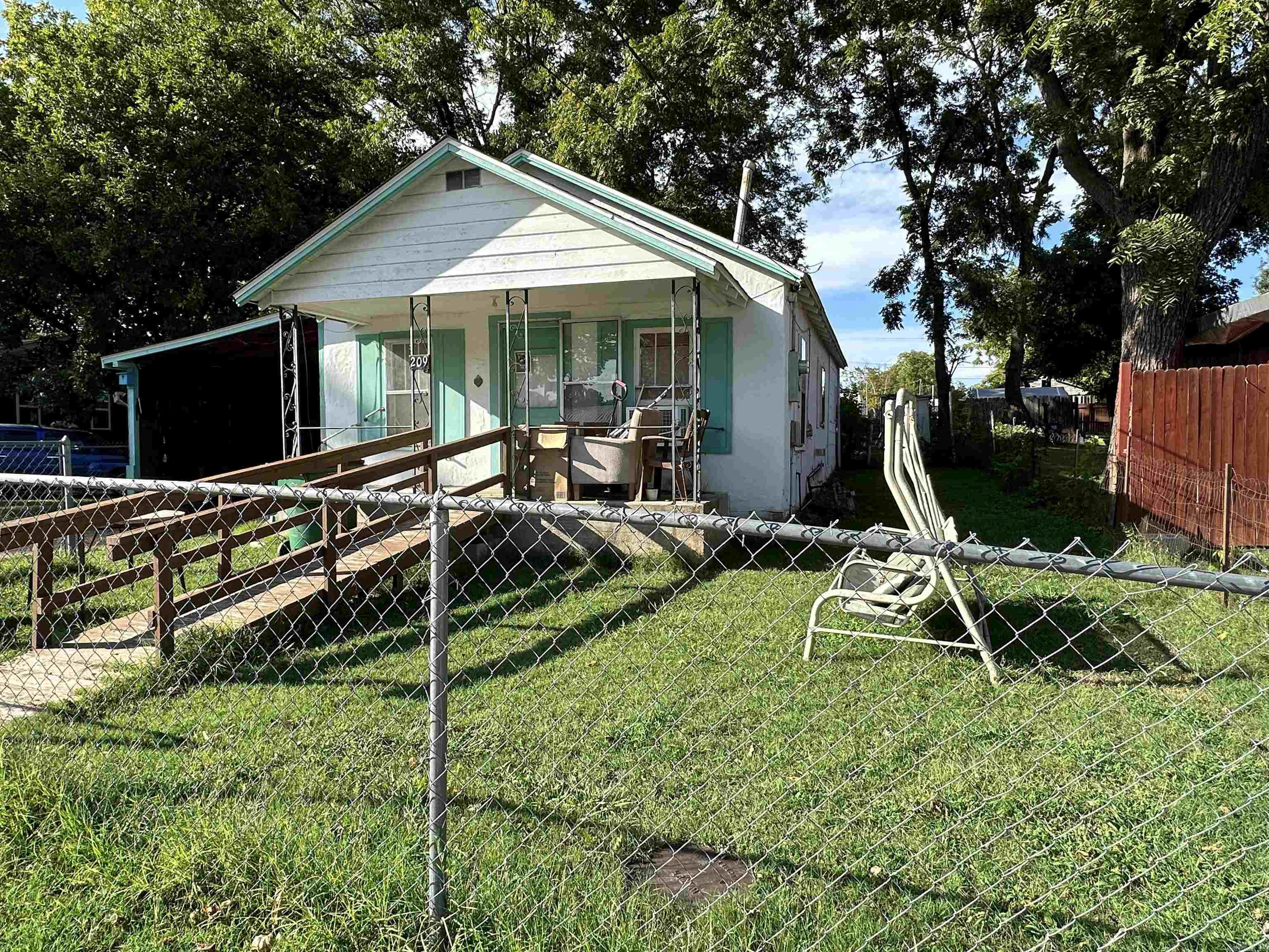 INTRODUCING A FANTASTIC OPPORTUNITY IN THE WORLD OF REAL ESTATE! This 2 bedroom, 1 bath home boasts a wealth of potential and is the perfect canvas for those looking to create their dream space. Nestled in a peaceful neighborhood, the property features a fenced backyard that's perfect for pets or outdoor activities. You'll appreciate the lovely front & back yards, offering a glimpse of greenery & tranquility. A detached carport provides a convenient shelter for your vehicles, while a storage shed offers extra space for your tools & belongings. It's an excellent choice for first-time home buyers looking to make their mark or investors seeking an attractive opportunity. With a bit of tender loving care this property can be transformed into a comfortable & stylish living space that suits your needs. This property is priced to sell quickly, don't let this fantastic opportunity pass your by.
