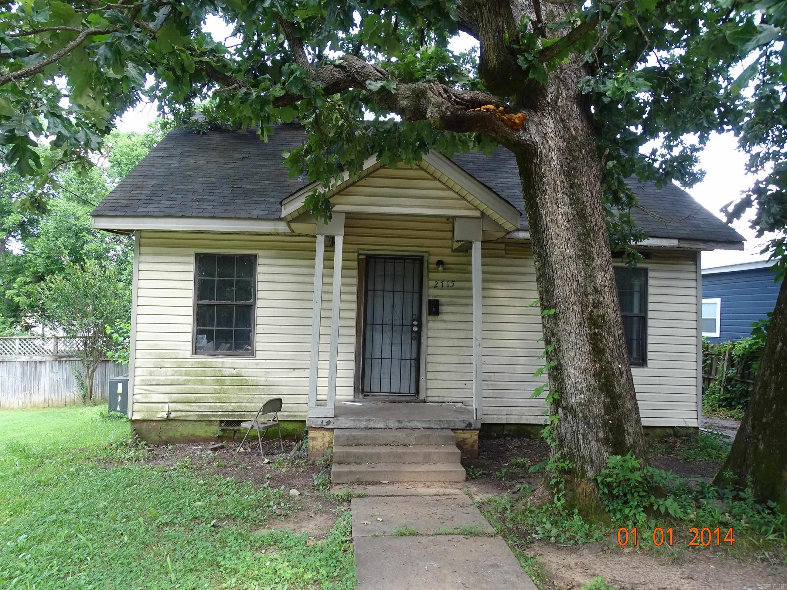 Check out this home.  It has a driveway at the front of the house and ally access in the back.  This home features a partially fenced yard and a large deck off the back.  It does need some work, but would be a great addition to your portfolio.
