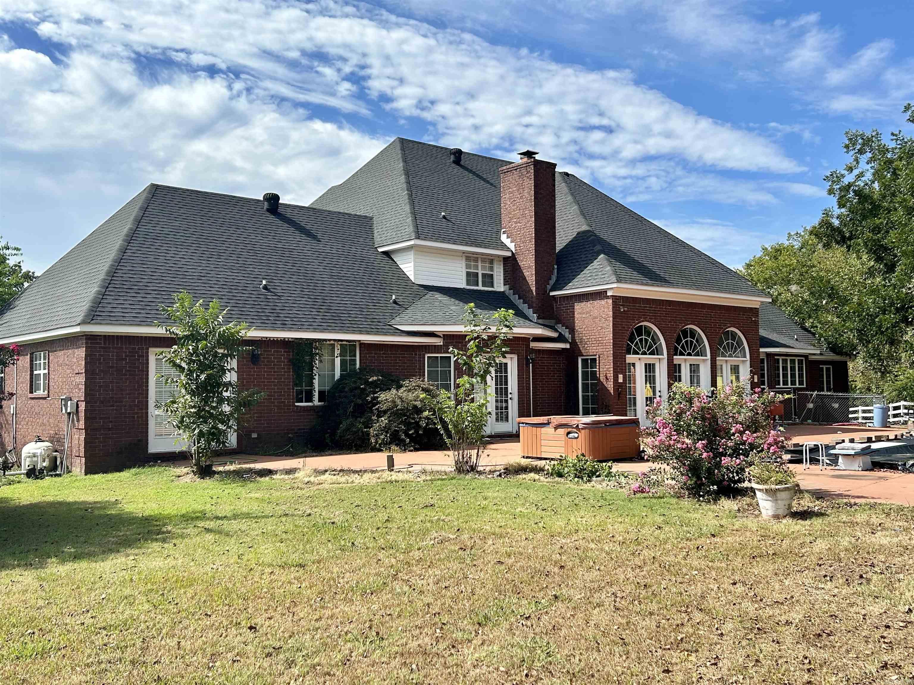 Experience luxury living in this custom-built estate home offering approximately 5,000 square feet of beautifully designed space on 2.55 scenic hillside acres. This impressive two-story residence is the largest estate home of its kind and combines elegance, comfort, and convenience in one remarkable property.  Inside, you’ll find upscale finishes throughout, including marble showers, granite countertops, a wet bar, a dedicated office, and a huge master suite with an impressive spa-like bathroom designed for relaxation. Every detail of this home was crafted with style and function in mind.  In addition to the main residence, the property also features a separate addition with two guest houses, each with its own individual garage, adding approximately 1,500 additional square feet of living space. This unique setup offers endless possibilities for guests, extended family, or private retreats or even rental income!!  Perfectly situated on a beautiful hillside, this exceptional property offers peaceful surroundings while being just minutes from the interstate, schools, and shopping.