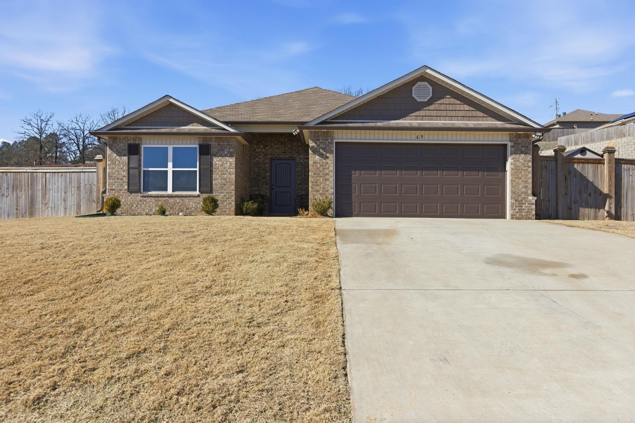 Welcome to 69 Dunnaway Dr — a beautifully maintained 4 bed, 2 bath home offering 1,896 sq ft of comfortable living in a quiet neighborhood in Austin, AR. This move-in ready home features an open-concept layout, stylish white cabinetry, granite-look countertops, and sleek black appliances. The backyard is fully fenced and includes a covered patio with ceiling fan, extended concrete pad, and a modern storage shed — perfect for entertaining or relaxing. Additional highlights include luxury vinyl plank flooring, a spacious 2-car garage, and excellent proximity to Hwy 67/167 and Cabot Schools. Come see why this home is the perfect blend of function and charm!