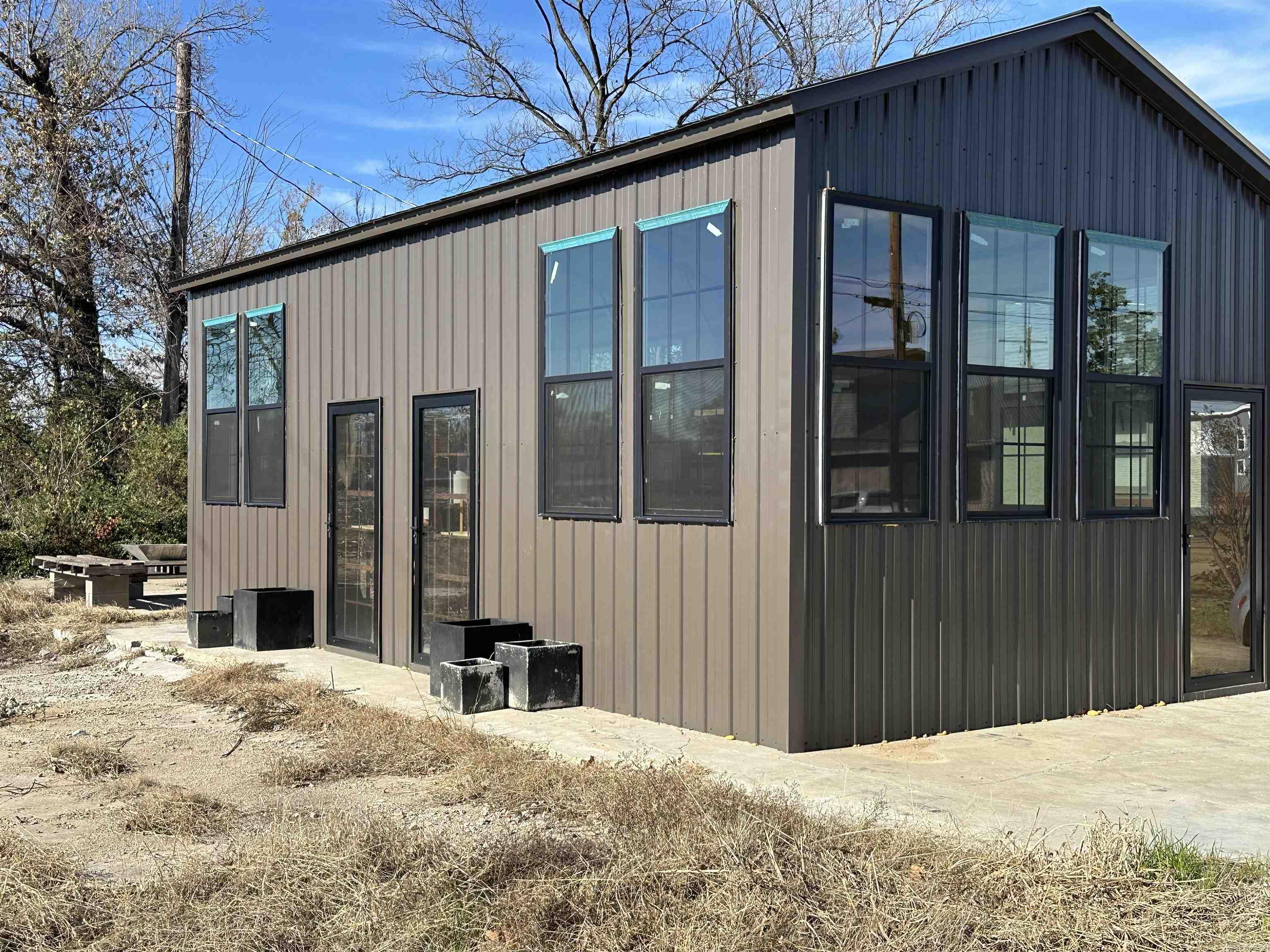 New 15 x 30 insulated building ready for finish-out. This newly constructed building is fully insulated and features 11-foot ceilings, offering a spacious, open feel. Ready to be finished to suit your needs, it would make an excellent tiny home, office, workshop, or small business space. The possibilities are endless with this versatile property.