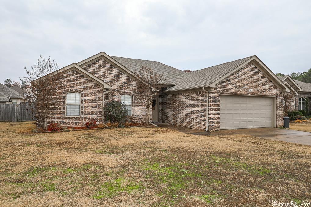 Welcome Home to this well cared for, lovely, 4 bedroom home!  Home has a nice size entry way leading to the spacious living area which has soaring high ceilings, canned lights, ceiling fan, beautiful wood flooring and gorgeous wood burning fireplace for getting extra cozy on chilly days.  The kitchen boast granite counters, lovely wood cabinets which include handy pull out shelves making the cooking equipment easily accessible and a built in pantry.  There is also a nice bay window allowing natural lighting in for eating your meals, or just drinking your coffee in the mornings.  The Primary suite includes an oversized private bedroom with tray ceiling and 2 windows.   The Primary bathroom has jetted tub, separate shower, and private water closet.  Nice size walk in closet is also off the Primary bathroom.  There are 3 nice bedrooms and a bath separated from the Primary suite.  This gives everyone their privacy.  Laundry Room is conveniently located between the kitchen and the 2 car garage.  Nice size privacy fenced back yard with a concrete patio, great space for entertaining and grilling.  This home is located only minutes from I-30, churches, shopping, and restaurants.