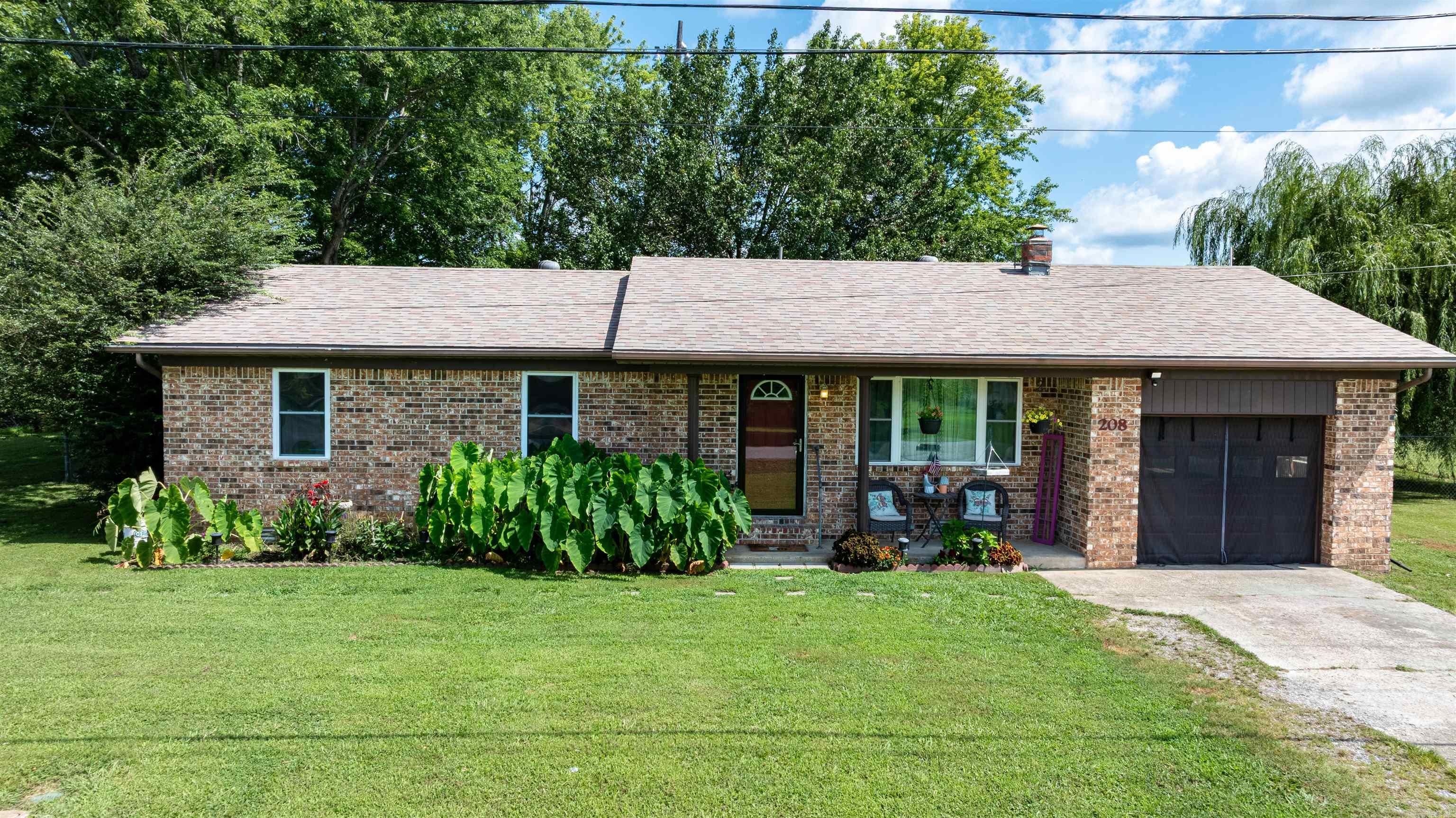 Welcome to this well-maintained 4-bedroom, 2-bath home located in one of Cave City's most convenient locations. Situated on a spacious lot with an additional lot included, this property offers the extra outdoor space you've been searching for while remaining within walking distance of Cave City Schools, restaurants, shopping, and everyday conveniences. Inside, you'll find a welcoming living room that flows into the dining area and kitchen, creating a comfortable layout for everyday living and entertaining. Down the hallway are three spacious bedrooms and a full bathroom, while the thoughtfully designed primary suite addition provides a private retreat complete with its own full bath and enough room to comfortably accommodate a king-sized bedroom set. The oversized laundry room offers additional storage and functionality that every homeowner will appreciate. Step outside to enjoy the large fenced backyard where children and pets can safely play beneath the shade of the beautiful mature willow tree. The detached storage building provides plenty of room for lawn equipment, seasonal décor, hobbies, or additional storage, while the included extra lot offers endless possibilities.