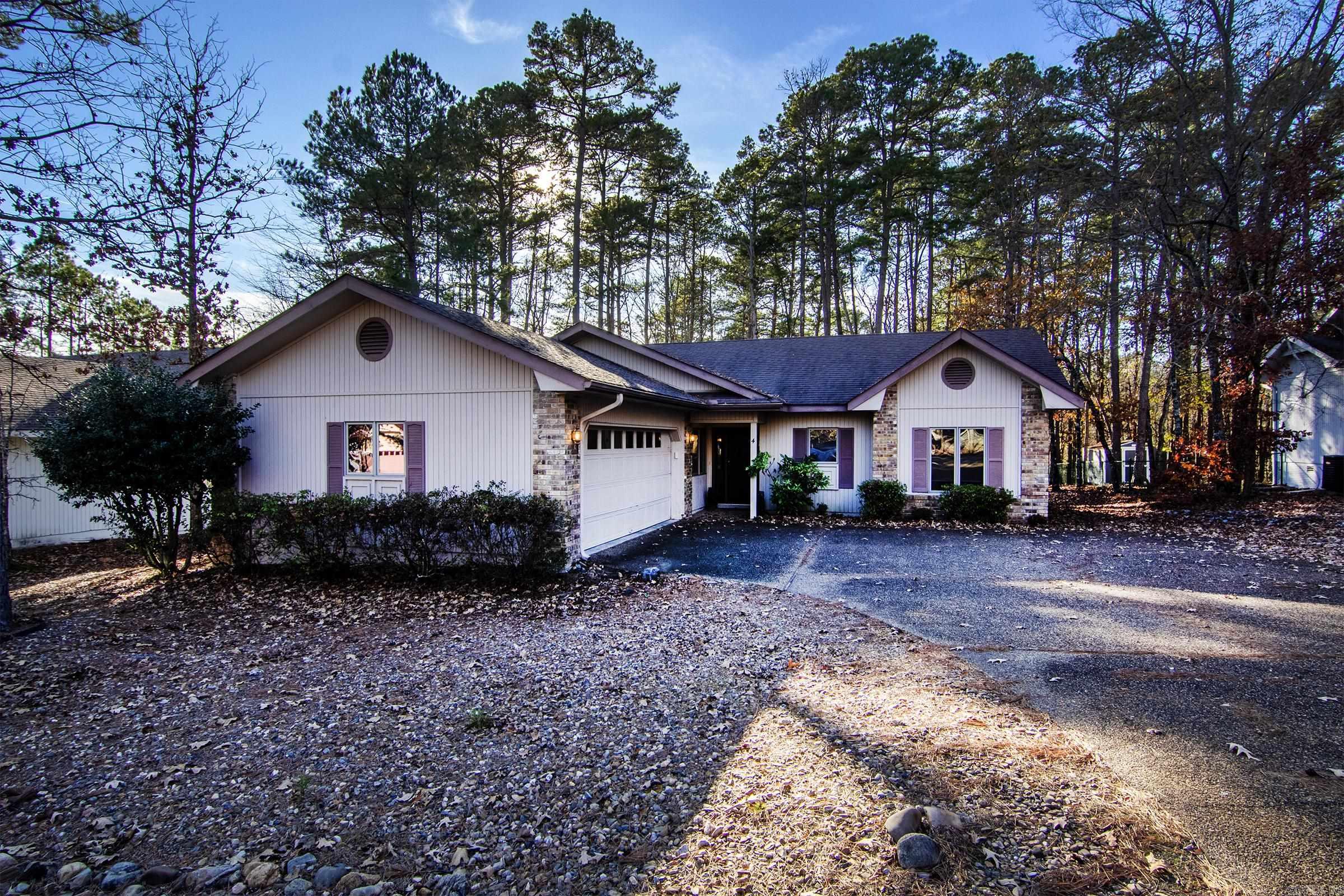 Welcome to this beautifully designed 3-bedroom, 2-bathroom home located in the serene and sought-after Hot Springs Village. Situated at 4 Playa Place, this property features an open floor plan that invites natural light and provides a spacious, airy feel throughout. As you enter, you'll be greeted by an open living area perfect for entertaining or relaxing. The living room flows seamlessly into the dining area and kitchen, making it an ideal space for family gatherings or hosting guests. The well-appointed kitchen boasts plenty of counter space, and ample cabinetry, making meal preparation a breeze. The master suite offers a peaceful retreat, complete with an en-suite bathroom featuring a vanity, walk-in shower, and a walk-in closet. Two additional bedrooms provide flexibility for family or guests. Enjoy the beauty of the surrounding nature from the comfort of your private backyard. Whether it's relaxing on the patio or exploring the amazing amenities, you'll love the tranquil atmosphere of Hot Springs Village.   Agents please see remarks.